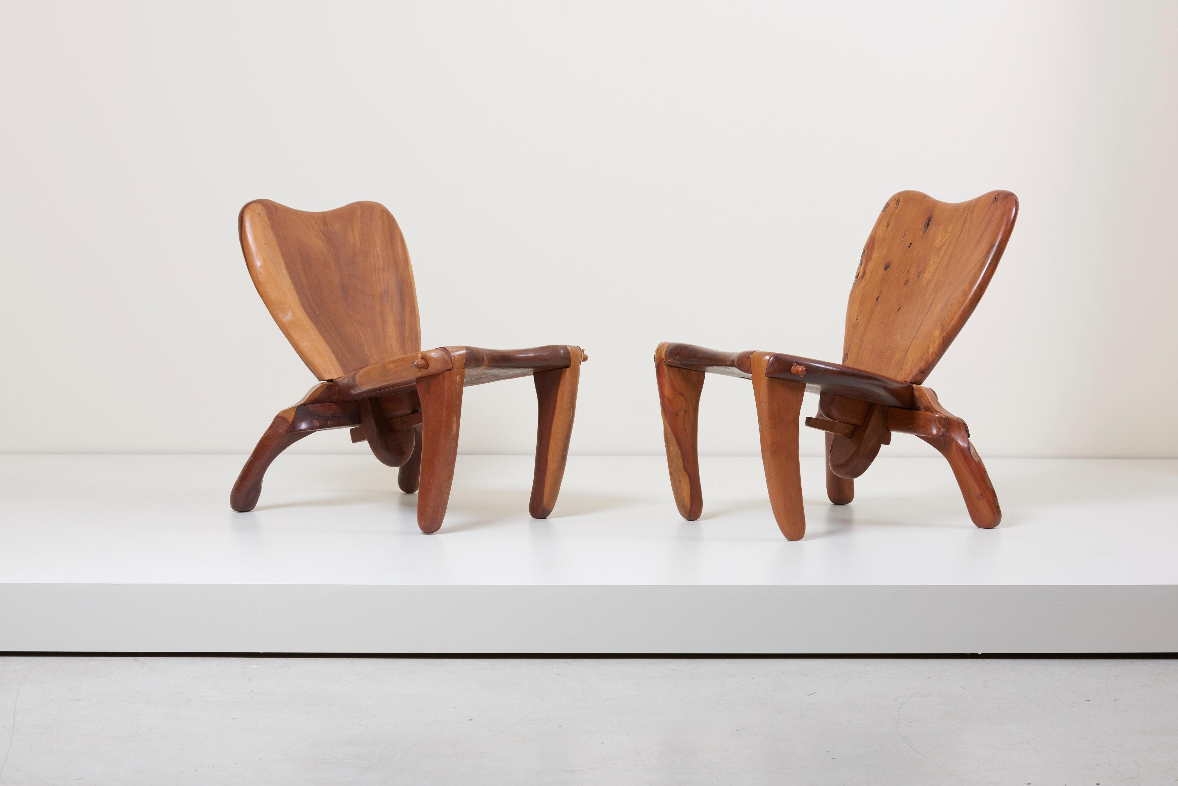 Highly sculptural studio crafted solid wood chairs by American-Mexican woodworker Don Shoemaker. Signed!
The chair has some old repaired cracks that already happened during the process of building these chairs. Typical Don Shoemaker!

