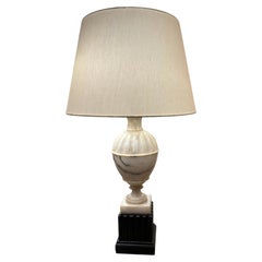 Pair of cream alabaster and black wood base lamps