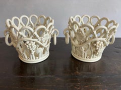 Pair of cream glazed faience cachepots