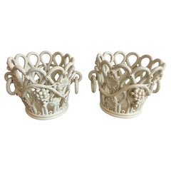 Pair of cream glazed faience cachepots