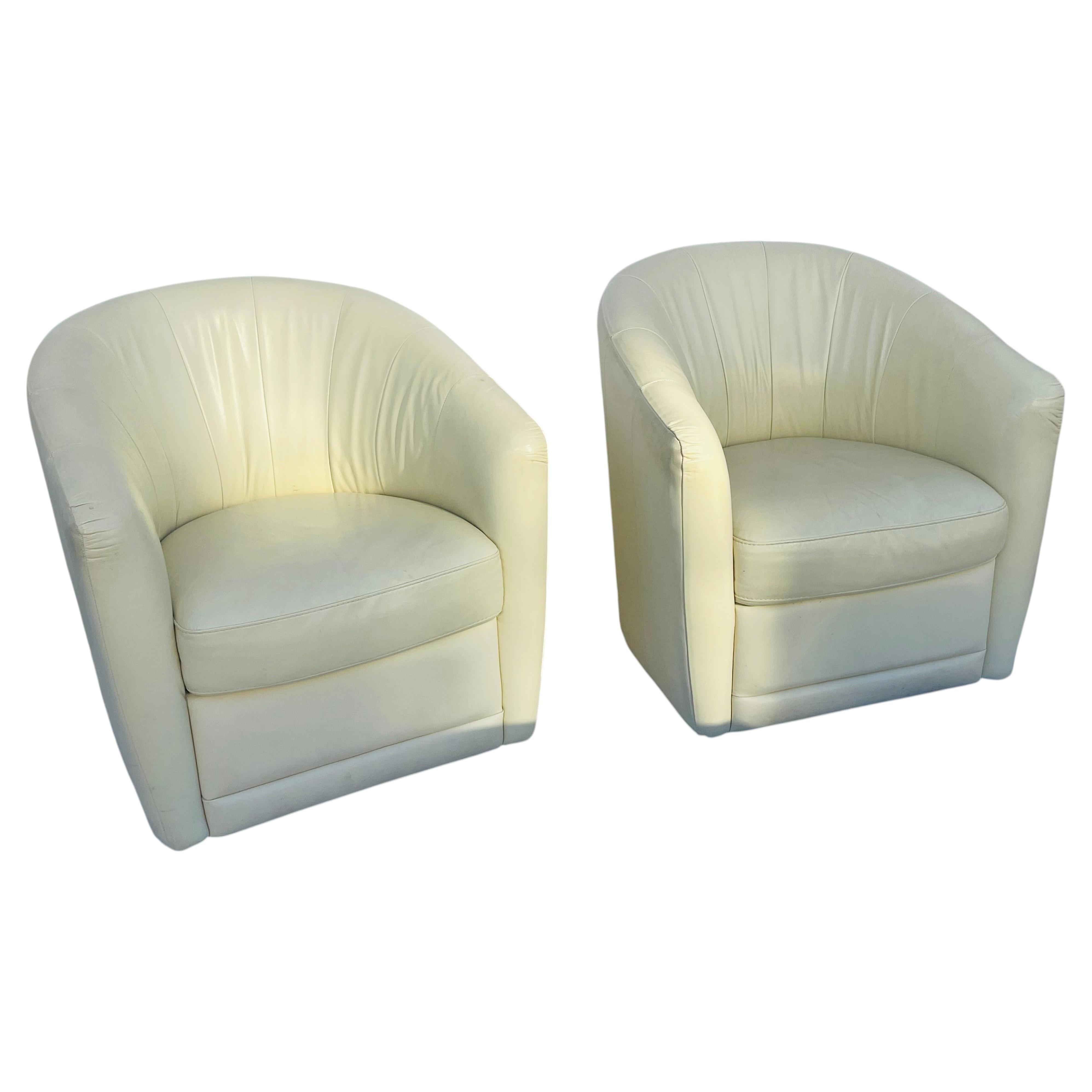 Pair of Cream Leather Natuzzi Barrel Back Swivel Armchairs