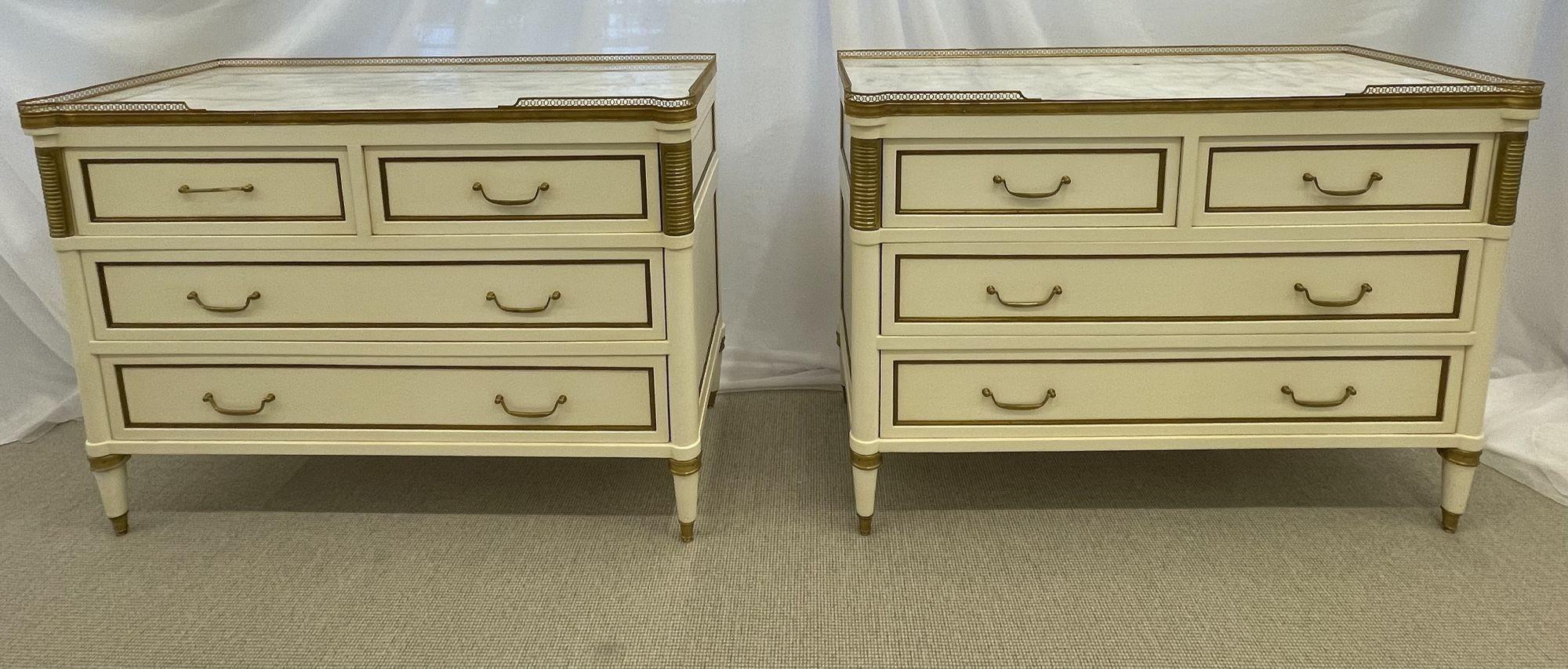 Pair of Cream Painted Louis XVI Style Commodes, nightstands, dressers, chests. Maison Jansen in Style
 
Stunning pair of Marble Top Hollywood Regency Style Commodes or Chests. Each having two drawers over two larger drawers under a pierced bronze