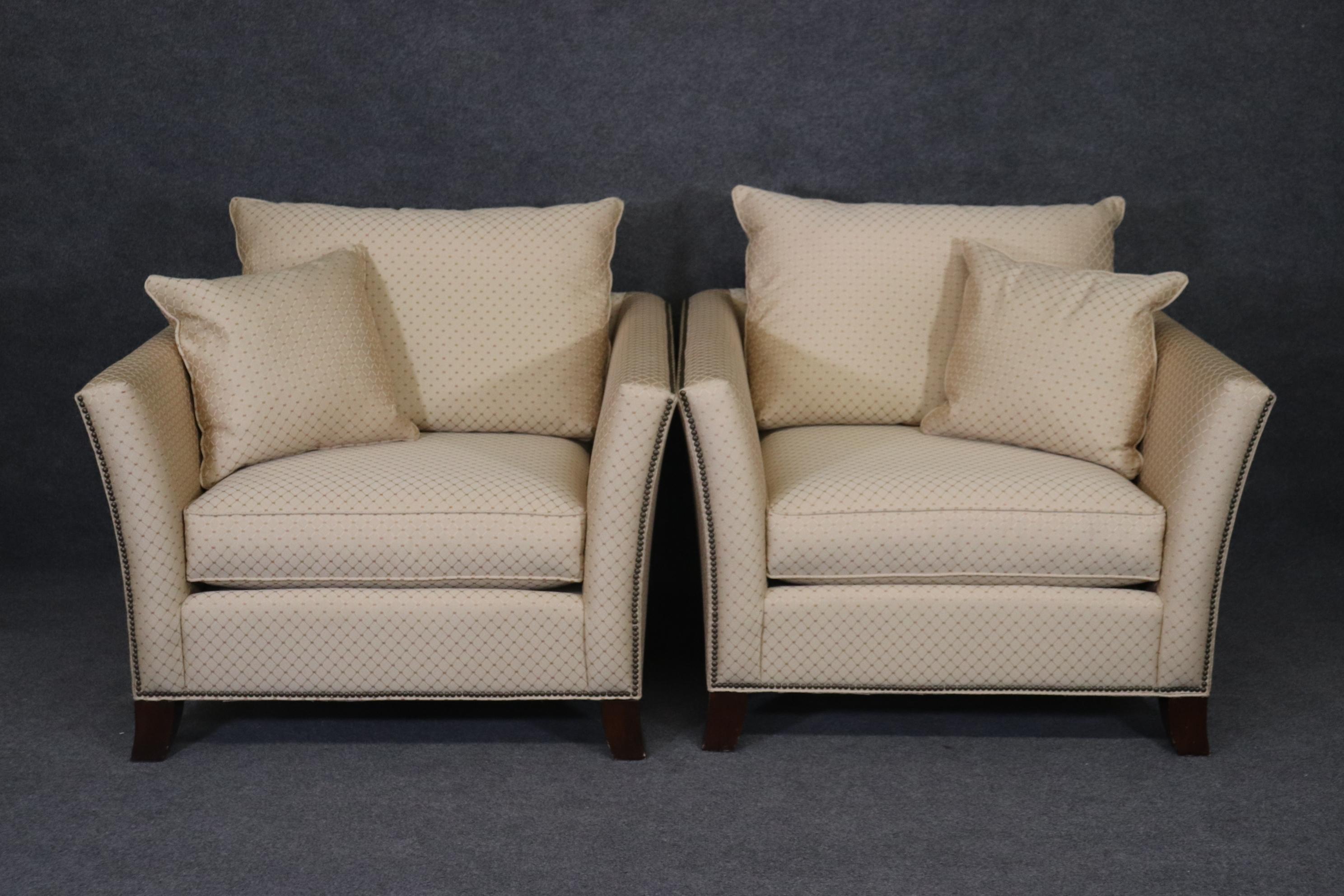This is a beautiful and very clean pair of cream or creme colored upholstered club chairs of generous over-sized dimensions. The upholstery is very clean for a used pair of chairs and while very clean, nothing used is perfect but these are very good.