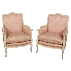 Pair of Creme Painted Rose Blush Hued French Louis XV Bergere Chairs