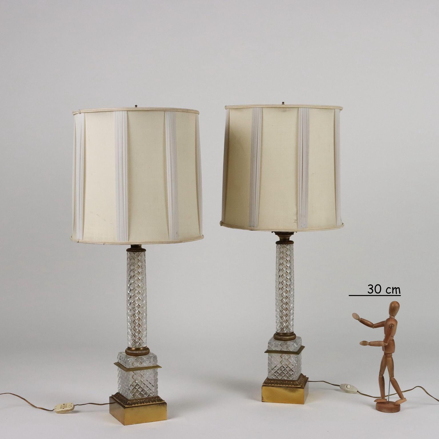 Pair of lamps in cut crystal and bronze with fabric lampshades. Adhesive label of the manufacturer under the base of a lamp.