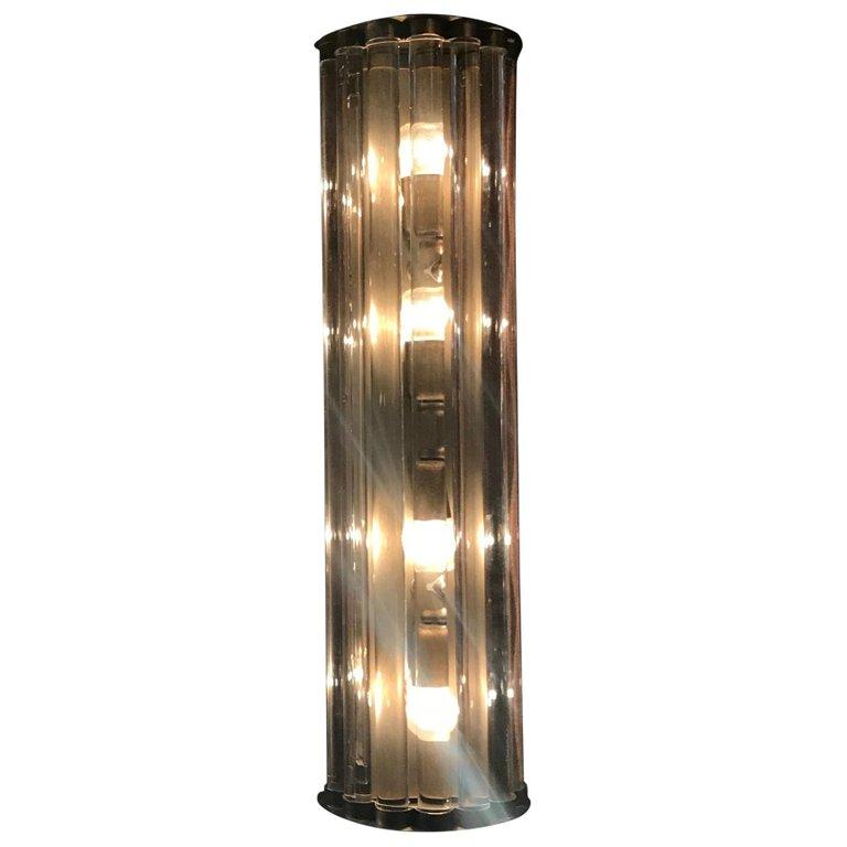 Italian wall lights or flush mounts with long crystal bars mounted on bronzed metal finish / Designed by Fabio Bergomi for Fabio Ltd / Made in Italy
4 lights / E12 or E14 type / max 40W each
Height: 28 inches / Width: 8 inches / Depth 4 inches
1