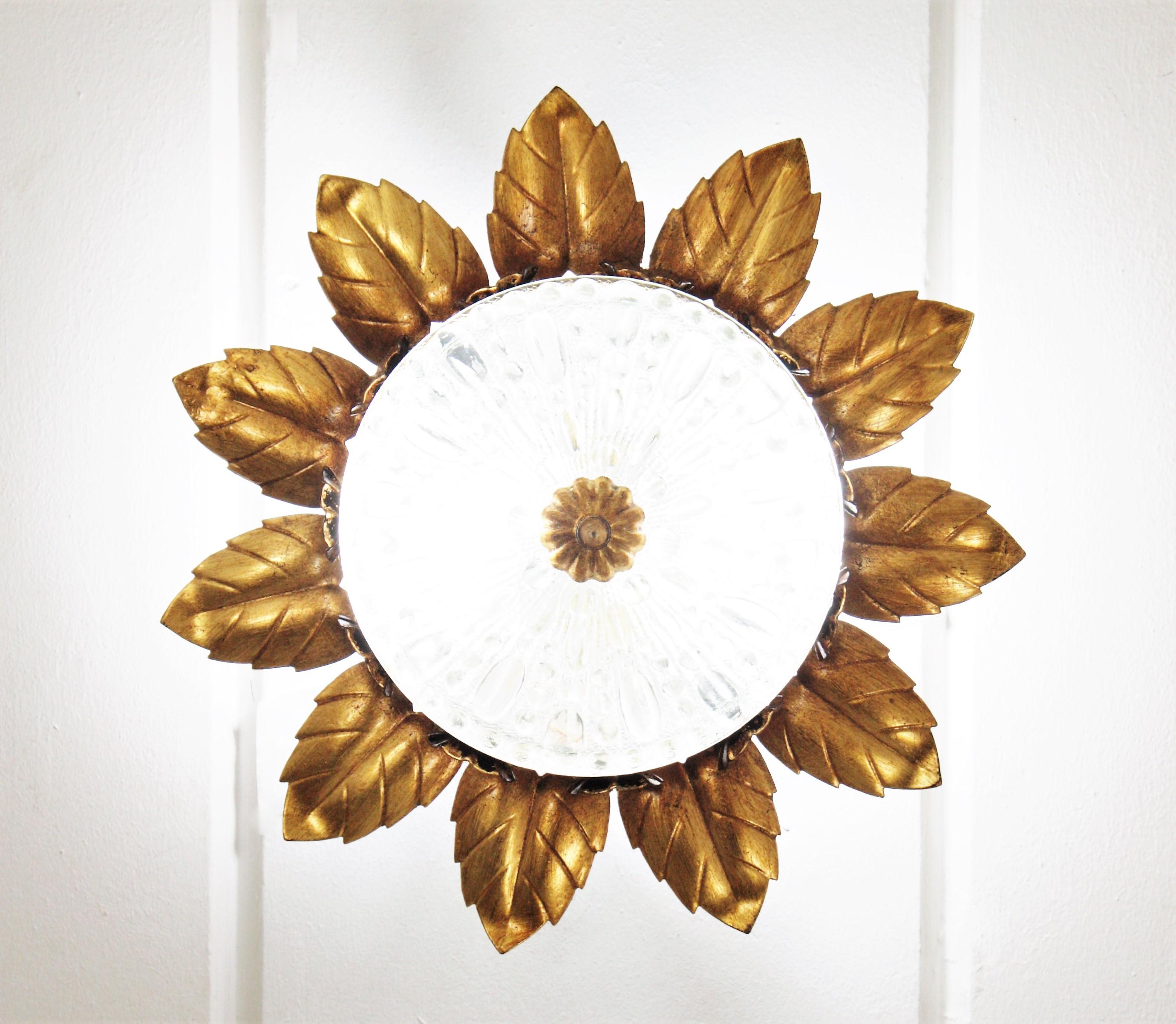 Pair of Sunburst Crown Flower Flush Mounts in Gilt Metal and Pressed Glass In Good Condition For Sale In Barcelona, ES