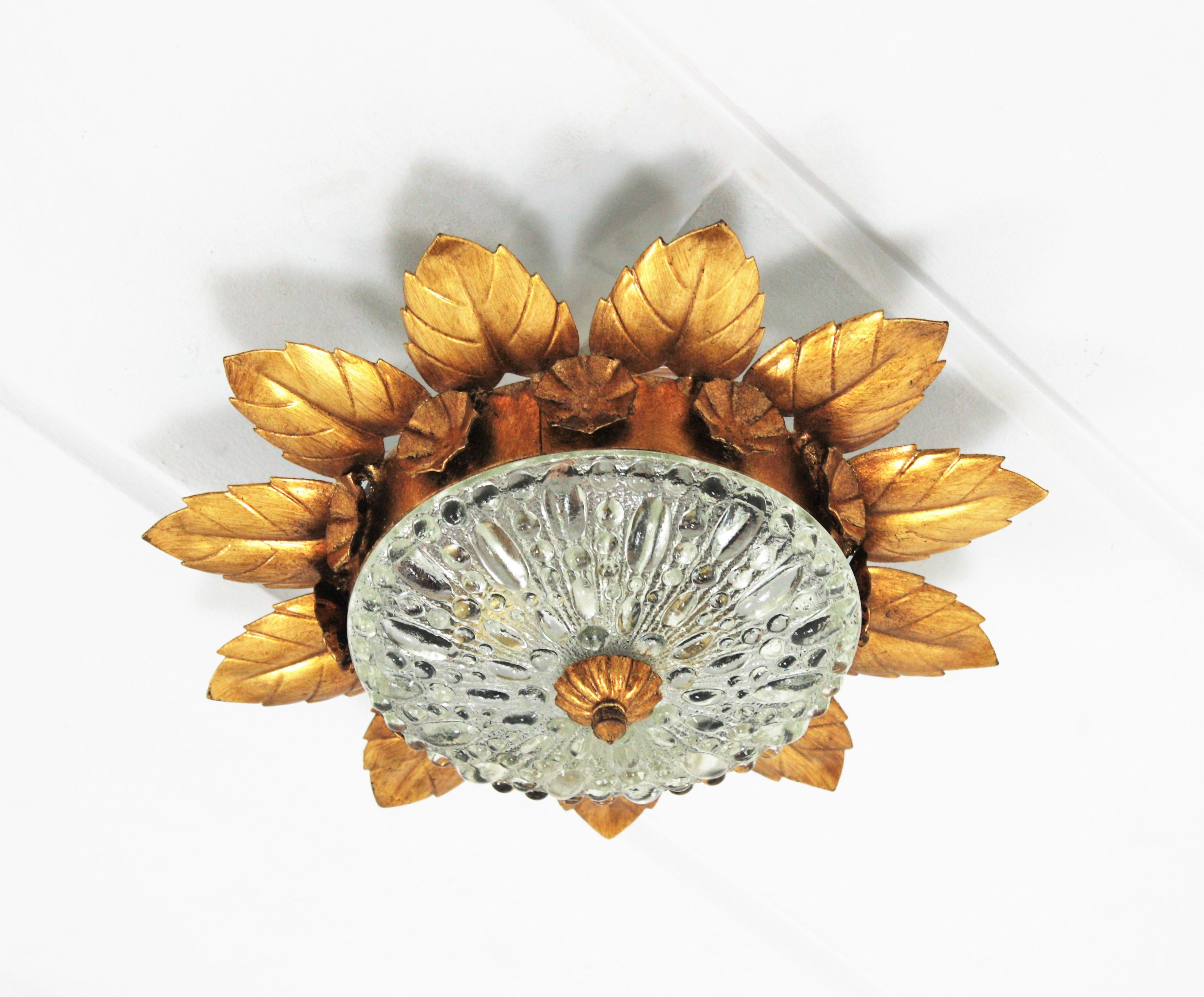 Gold Leaf Pair of Sunburst Crown Flower Flush Mounts in Gilt Metal and Pressed Glass For Sale