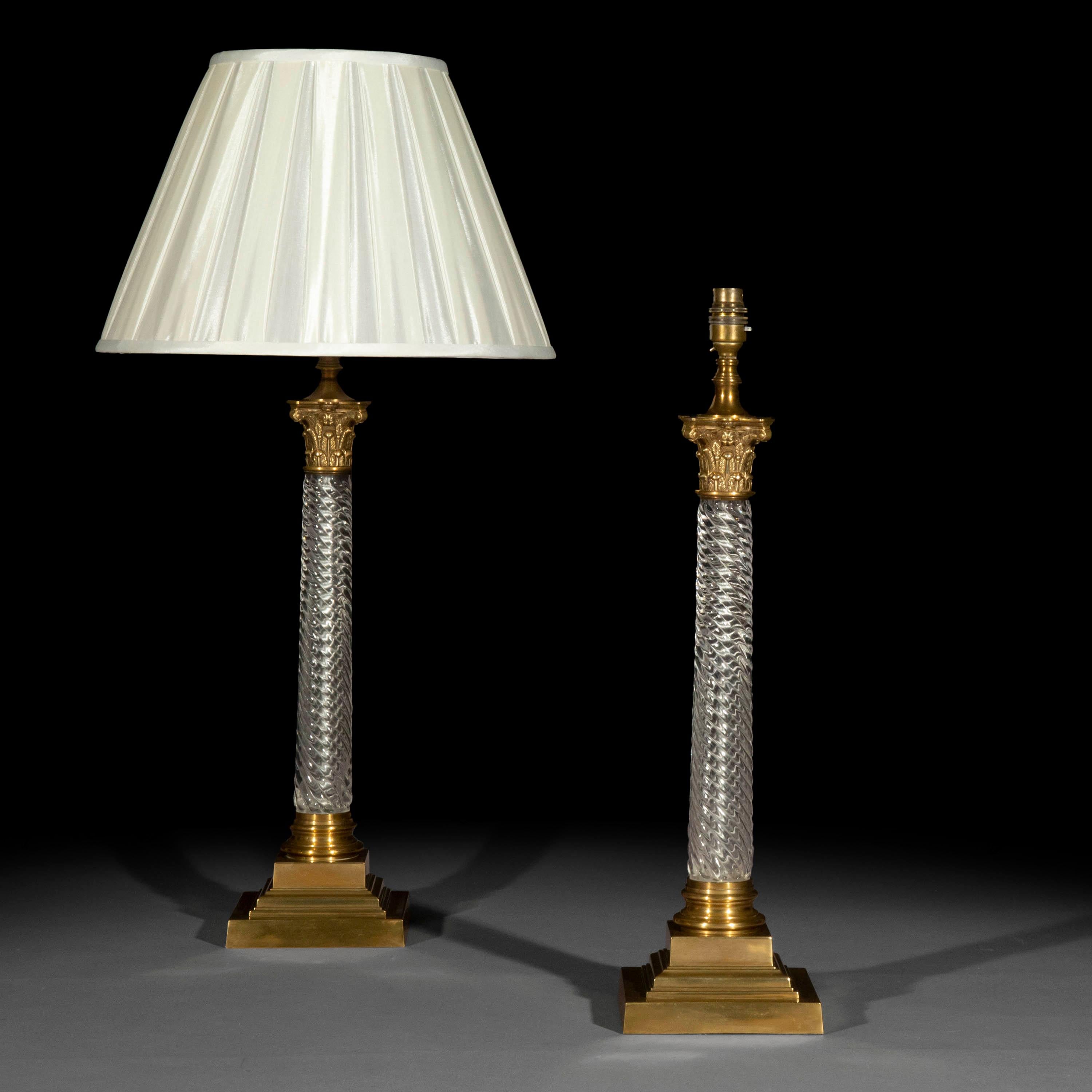An impressive pair of finely cast, lacquered brass and glass table lamps, fashioned as Corinthian columns.

20th century.

Ultimately classical, timeless design inspired by the classical examples, these elegant table lamps are