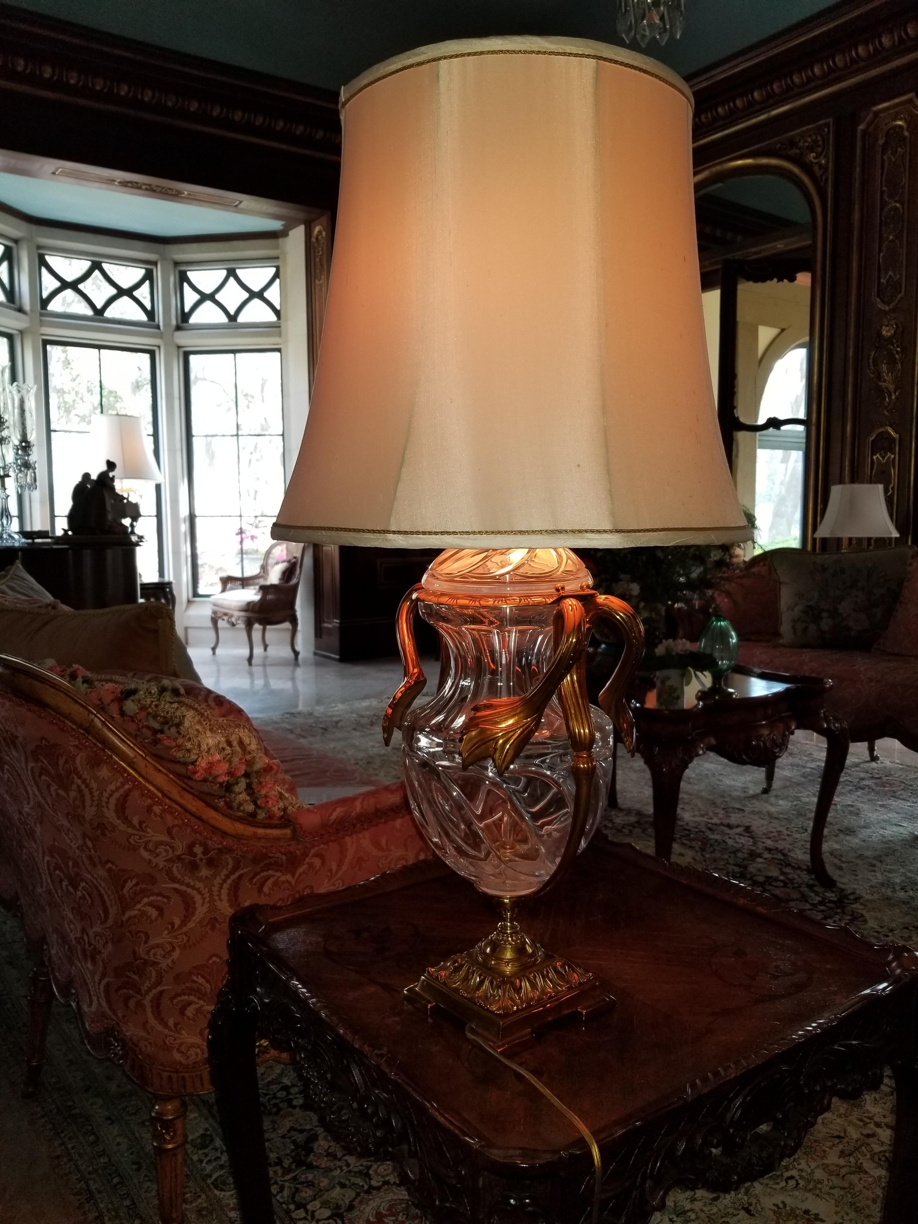 Pair of crystal and gold washed over brass lamps, 20th century.