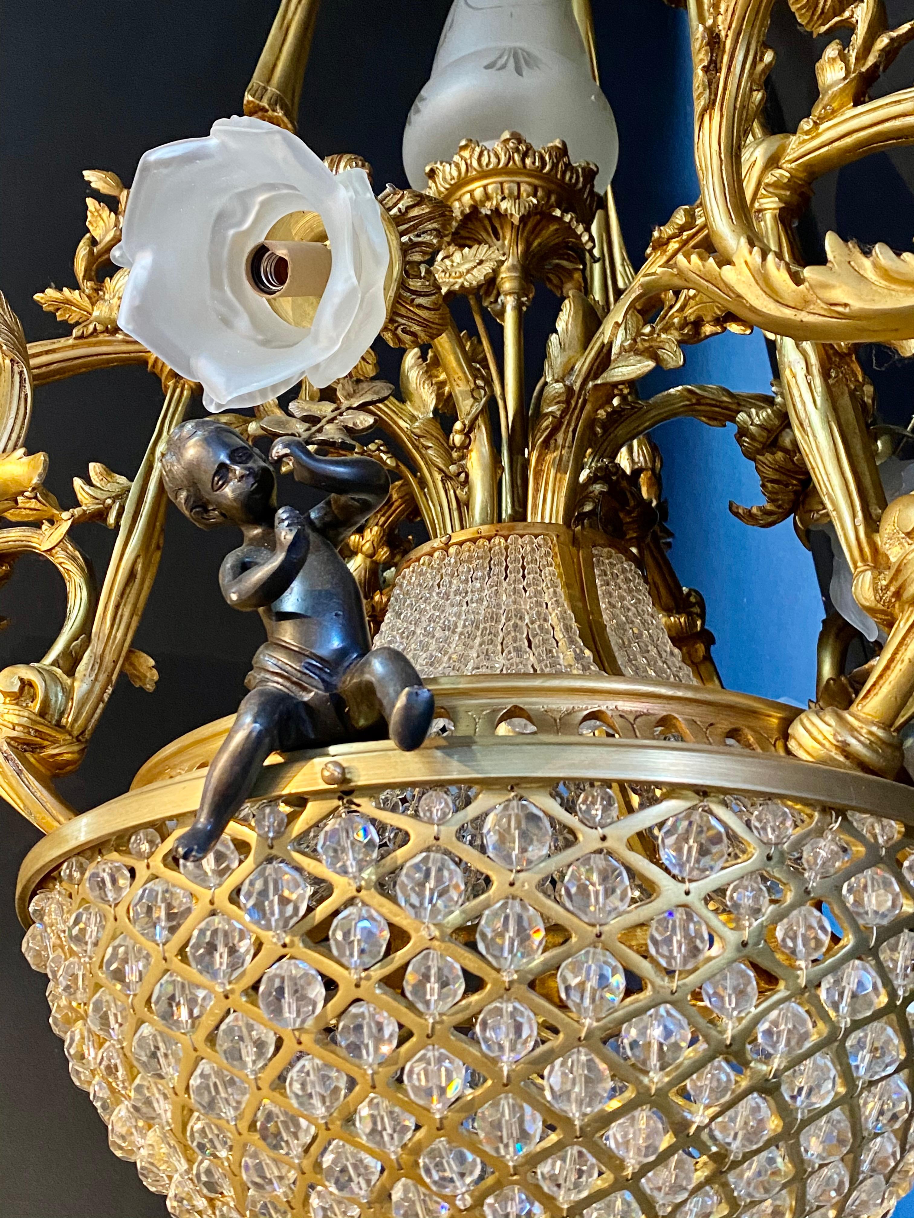 Pair of Crystal Beaded Globe Dore and Patinated Bronze Cherub Form 15-Light 8