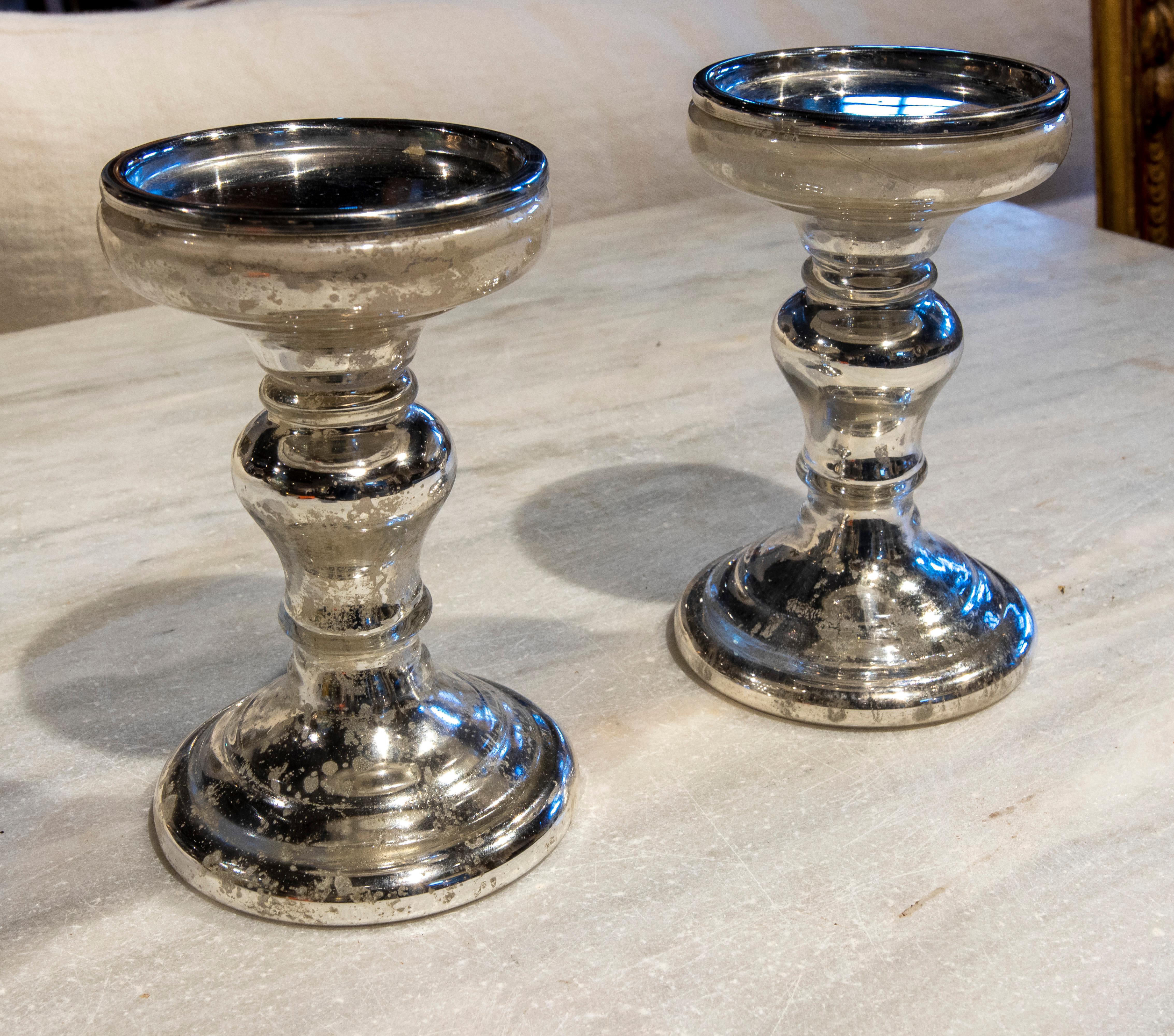 Pair of crystal candlesticks with mirror.