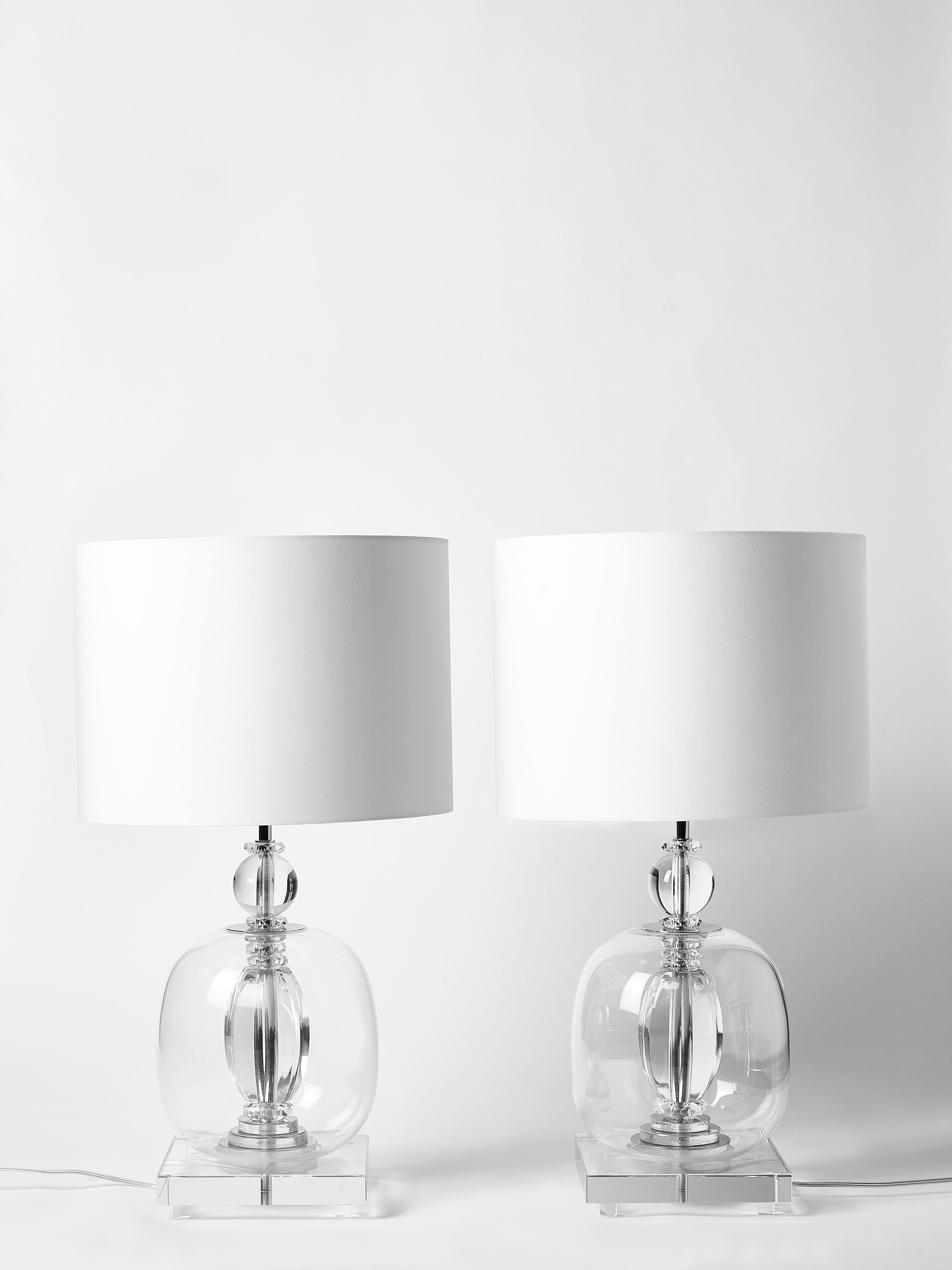 Pair of table lamps made of a stack of different pieces of transparent plexiglass and Murano glass giving the lamp a very clean and pure aesthetic.