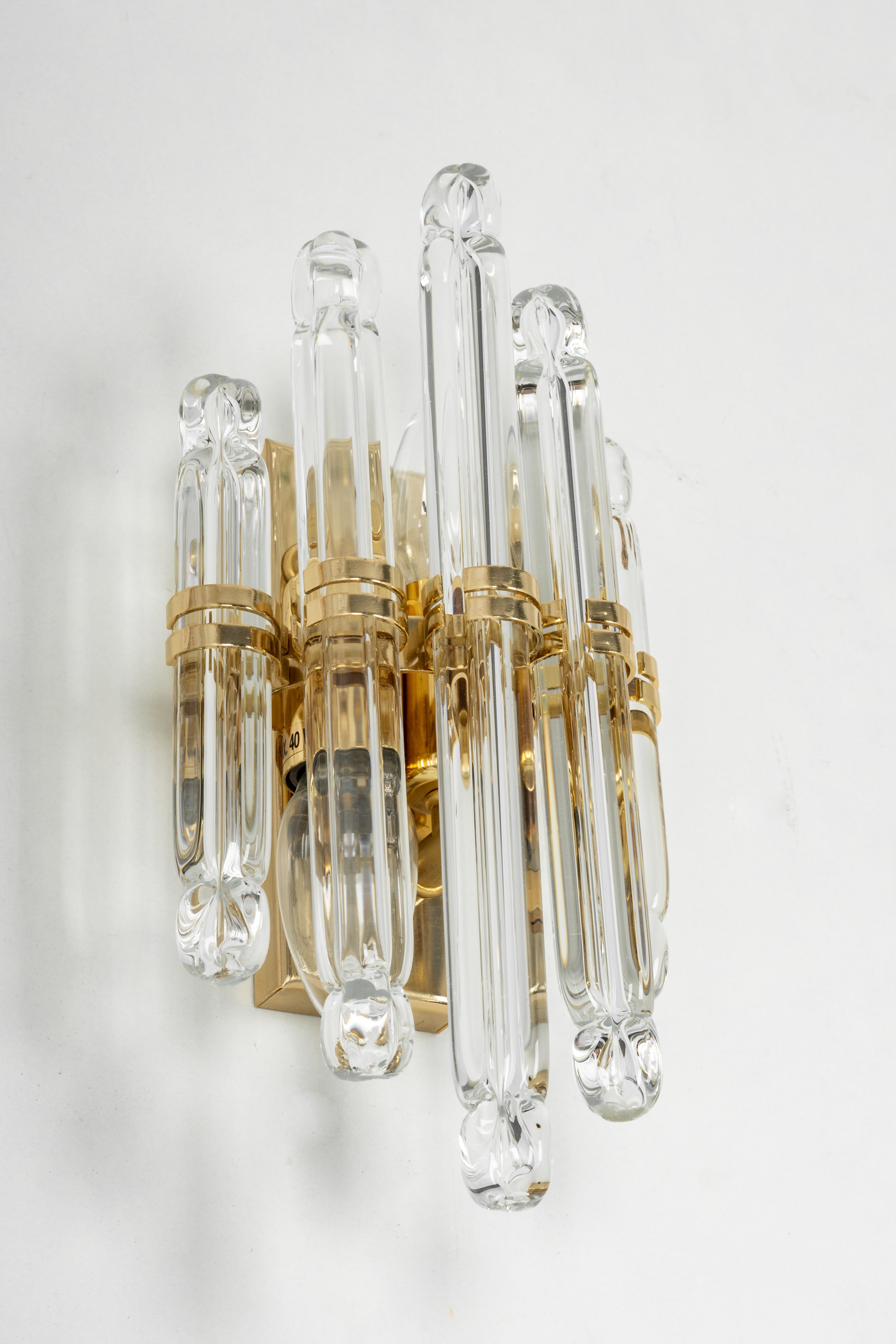 Beautiful wall light with 5 crystal glasses on a gilt brass frame-design in Venini style, Italy. Manufactured circa 1970s.
High quality and in very good condition. Cleaned, well-wired and ready to use. 

Each fixture requires 2 small bulbs