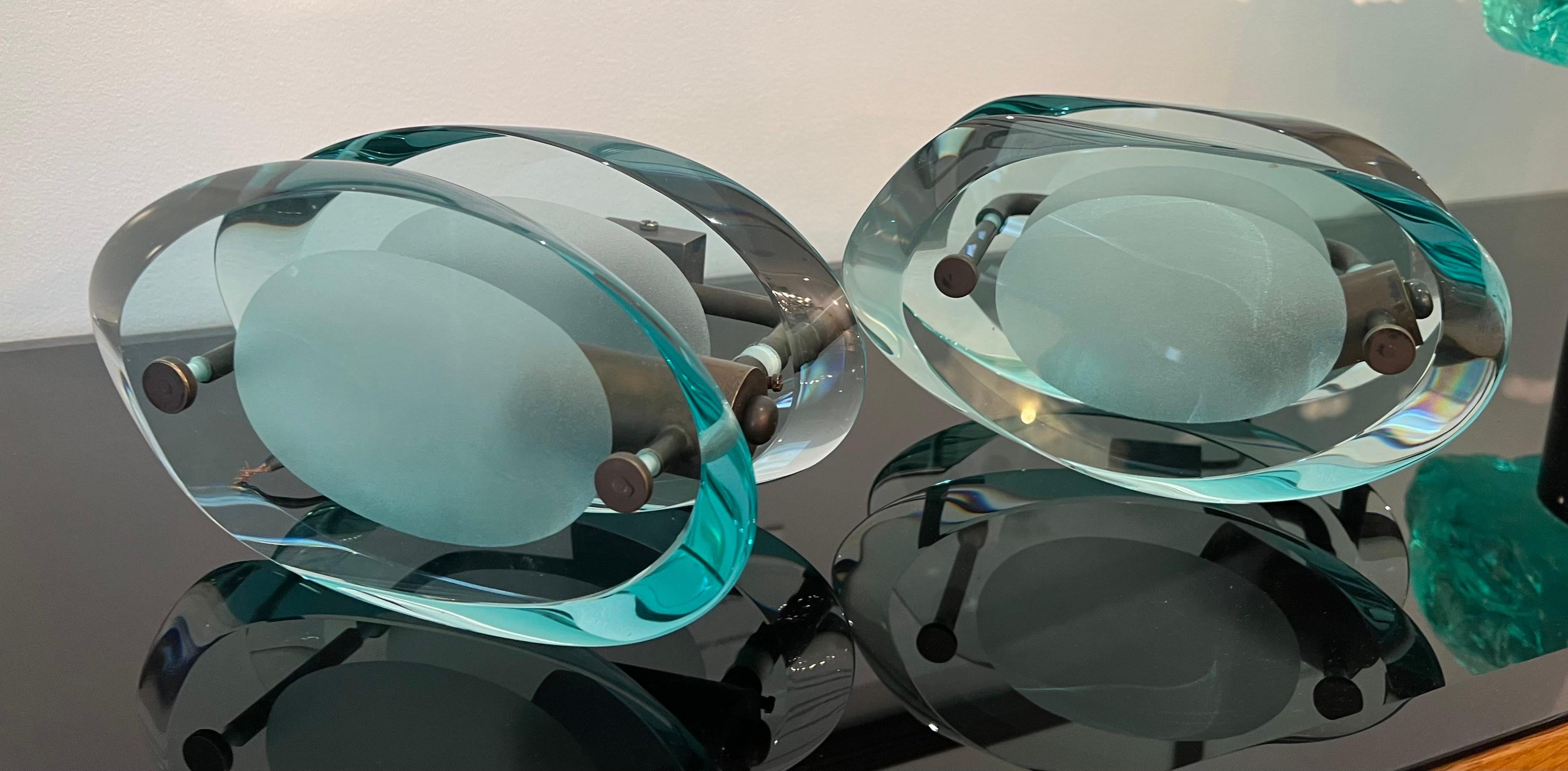 A pair of organically shaped sea green crystal glass wall sconces attributed to mod.2093 by Max Ingrand for Fontana Arte . C1950s 

Dimensions: D:17cm W:12cm H:22cm