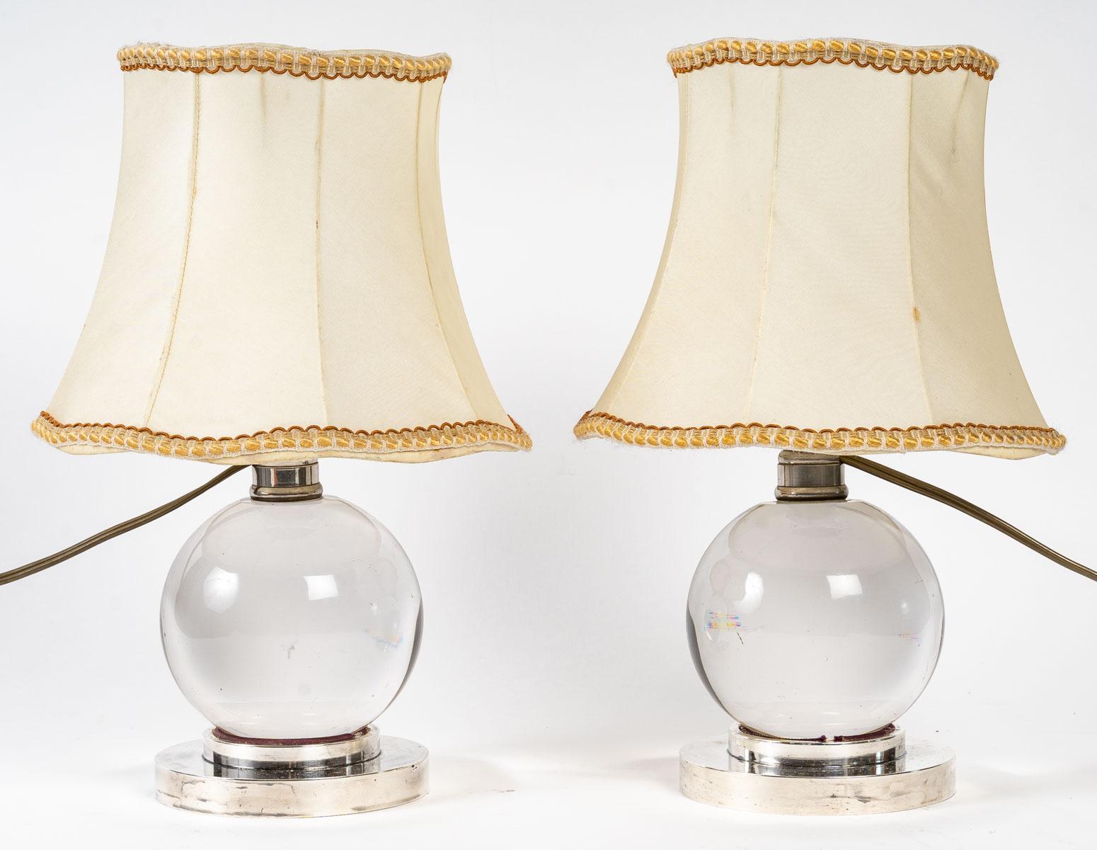 Pair of crystal lamps by Jaques ADNET
Baccarat crystal ball lamp base resting on a nickel-plated bronze base allowing the ball to swivel. Original lampshade.
With lampshade - h: 30 cm, w: 20 cm
ref 3224