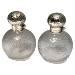 Pair of Crystal Perfume Bottles with Hammered Sterling Silver Tops