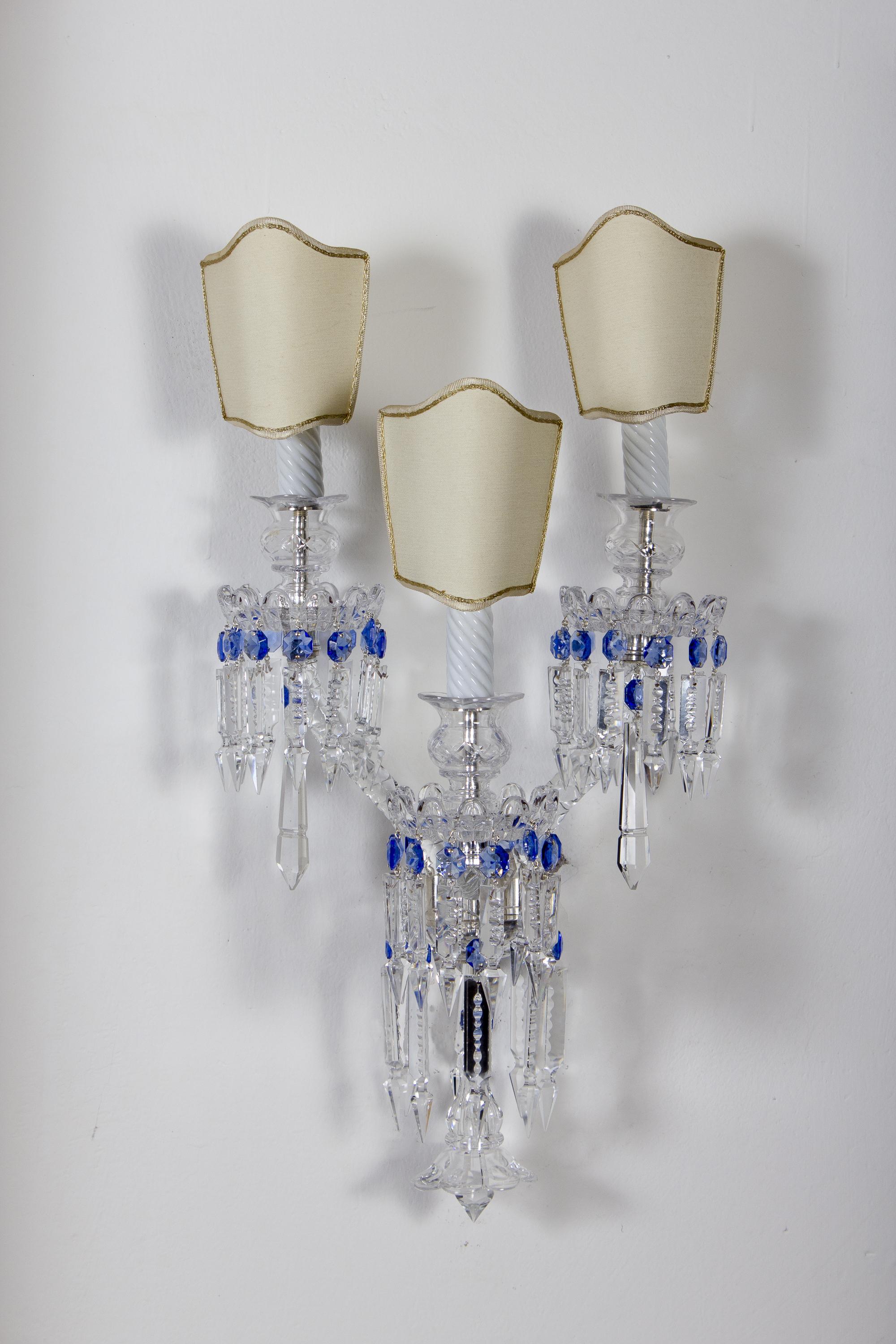 Pair of elegant crystal sconces each with five candleholders.