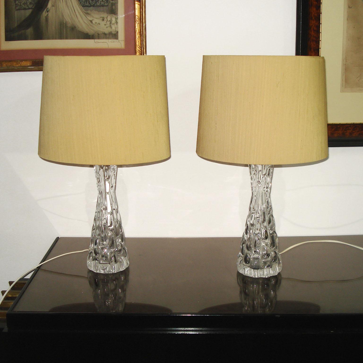 Exceptional pair of thick relief heavy crystal table lamps with polished nickel hardware by Orrefors. Signed under the bottom. Signed on the nickel top finial, 