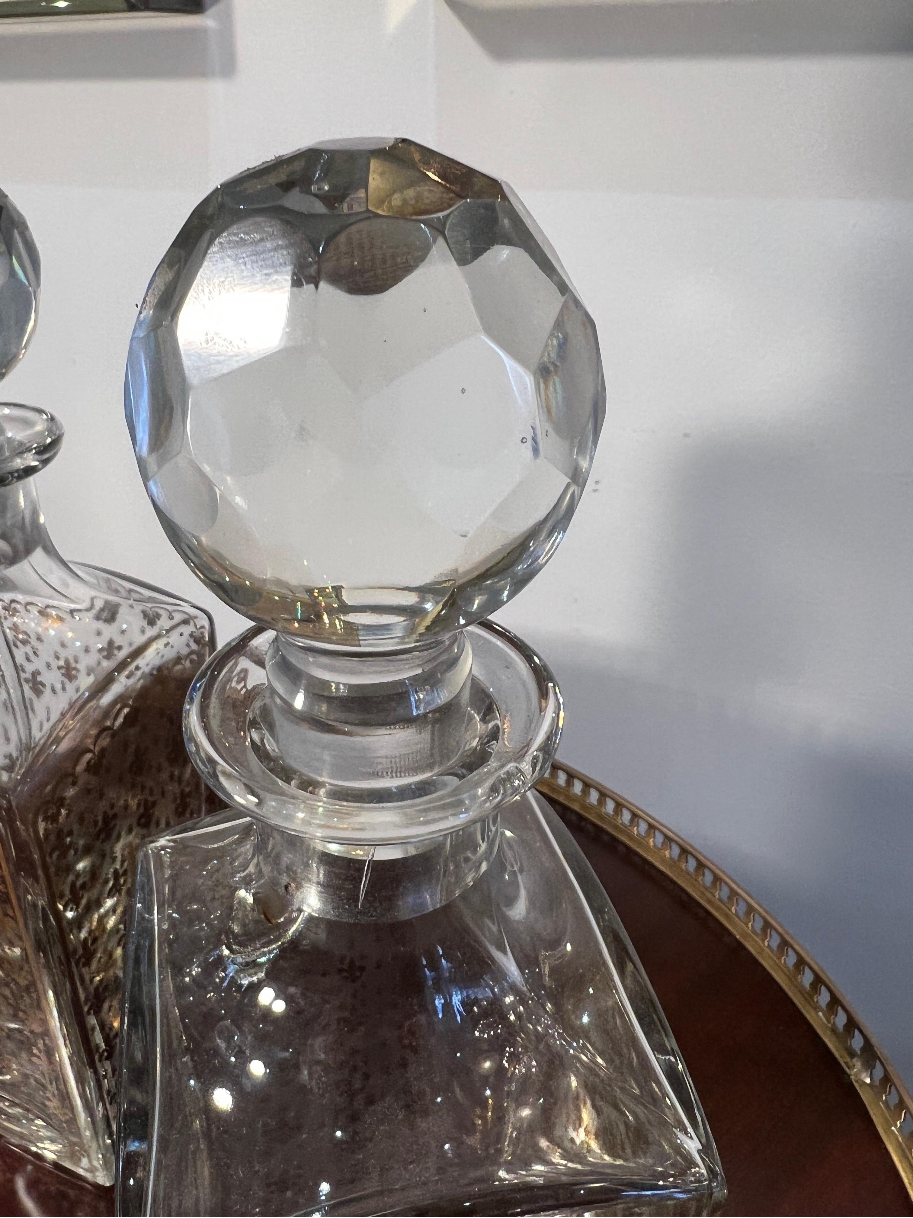 French Pair of  crystal whiskey decanters with fleur de lis motifs  For Sale