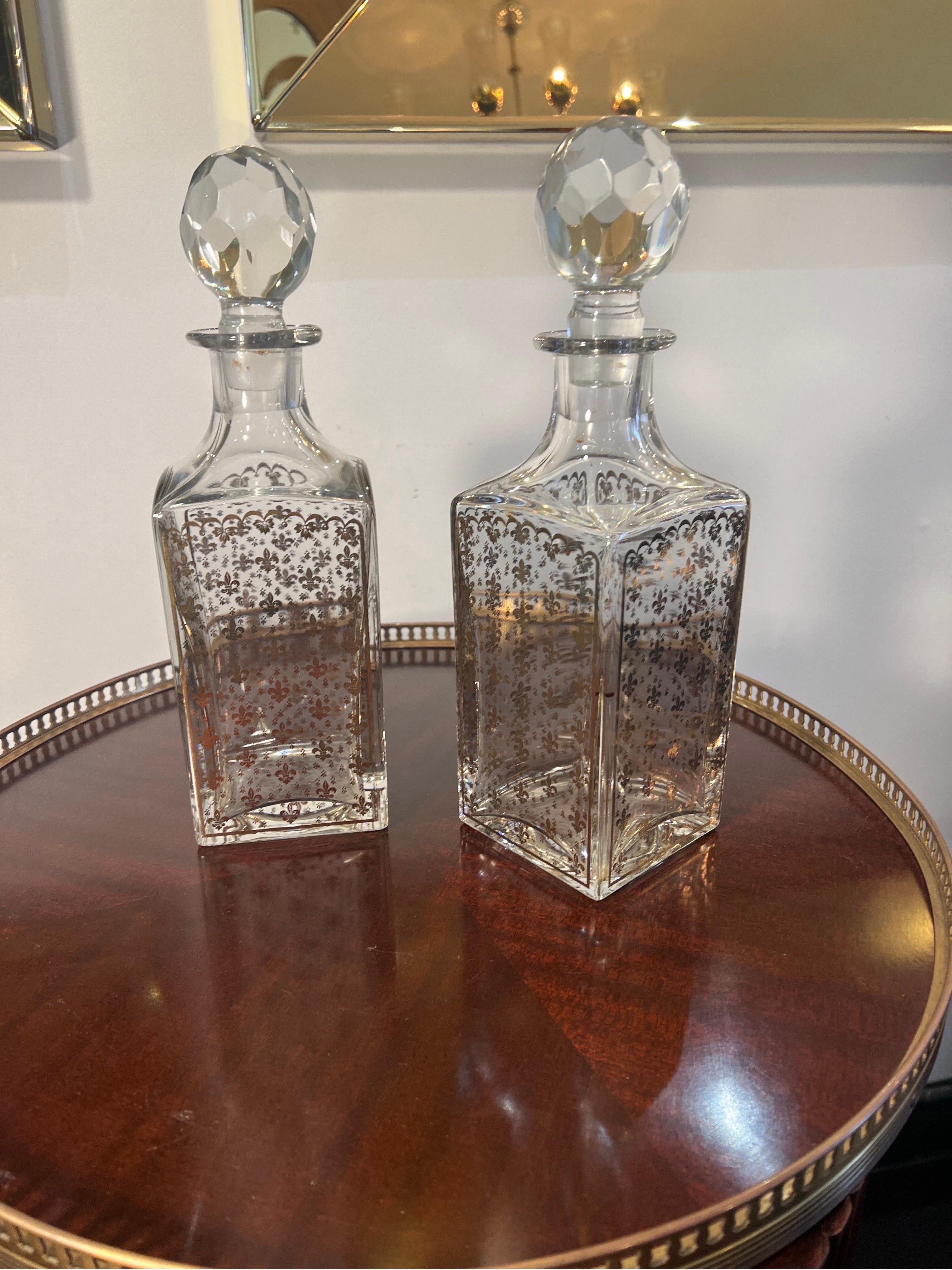 Gilt Pair of  crystal whiskey decanters with fleur de lis motifs  For Sale