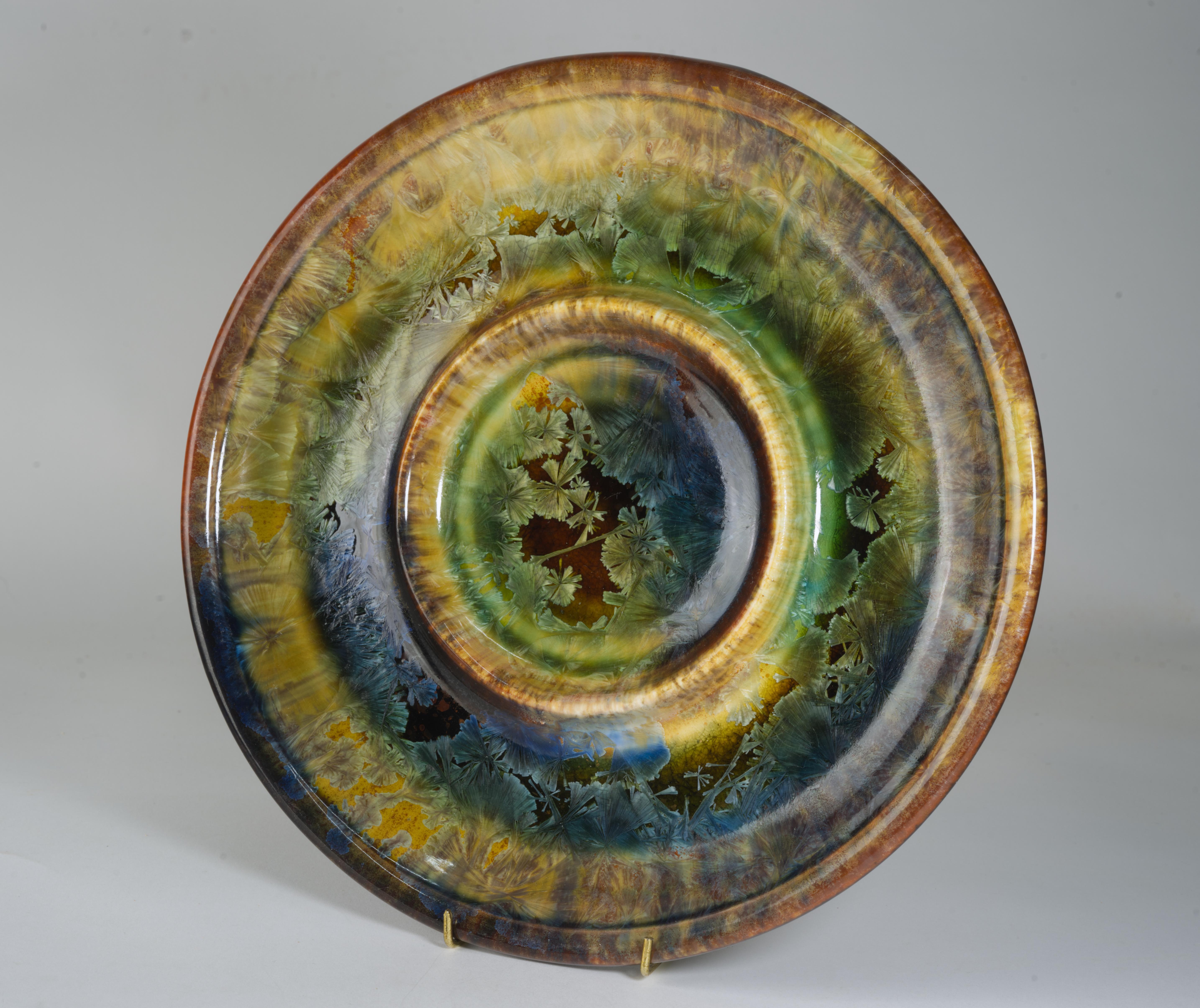 Pair of round divided plates was handmade by Kent Follette of Follette Pottery. Each plate has two compartments and is hand decorated with elaborate crystalline glaze in brown and blue palette, creating an appearance of ice breaking on top of the