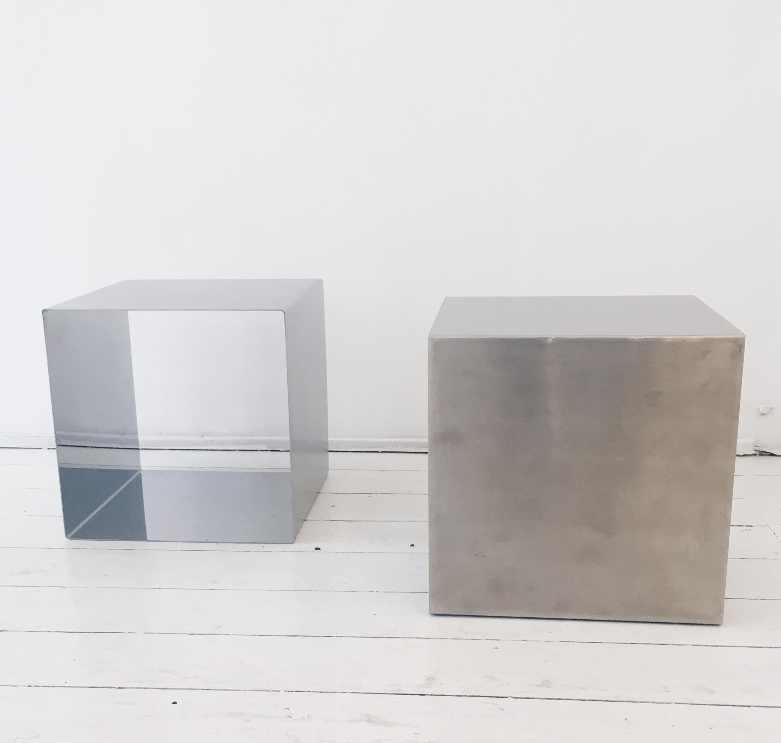 Pair of cube model coffee tables by Maria Pergay from the 1960s. In polished stainless steel and brushed stainless steel on the outside. Accompanied by their original signed certificate. Good condition with some scratches. Price for the pair