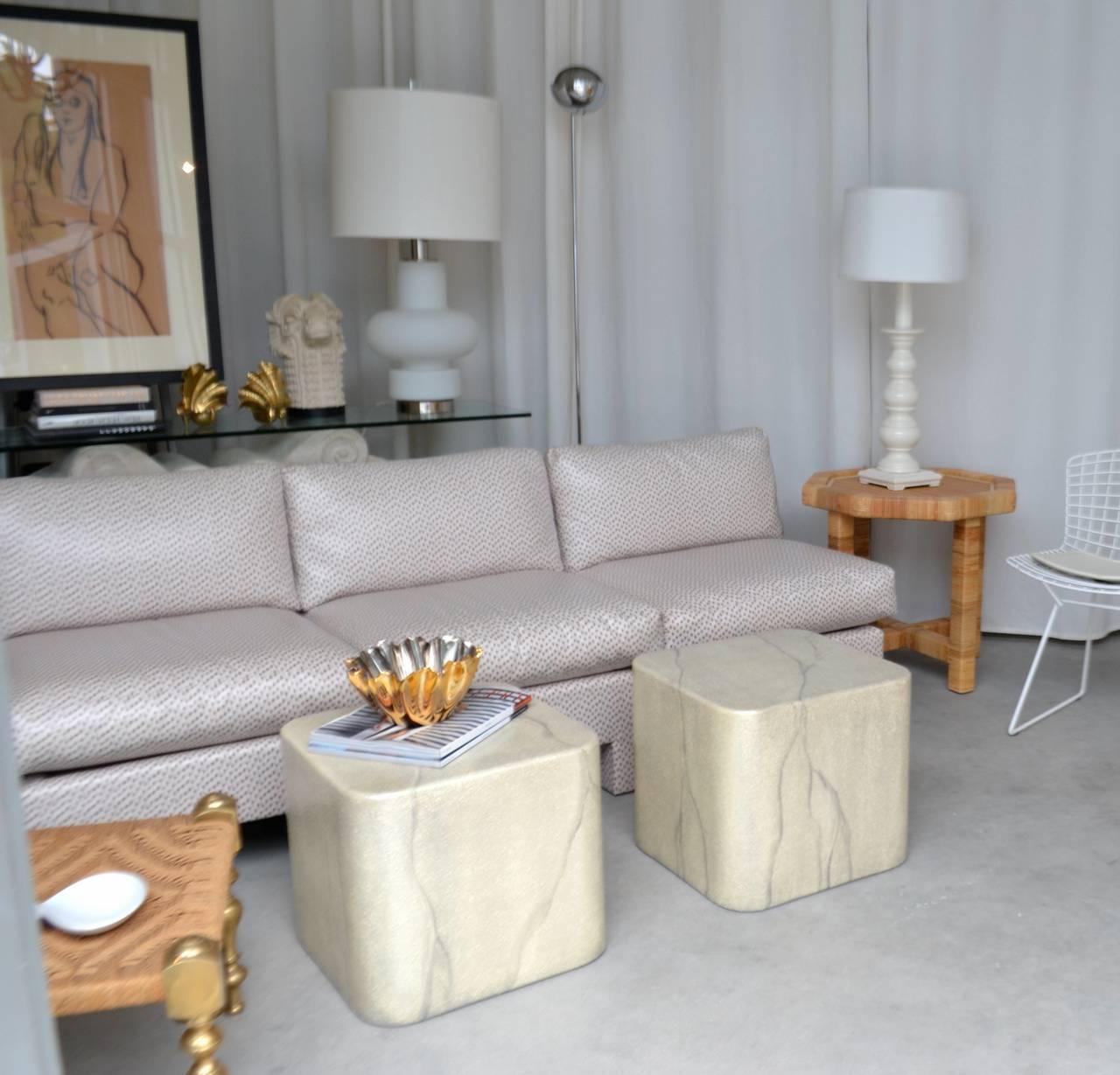 Striking pair of Postmodern cube form side tables, circa 1980s. These custom-made minimalist tables are artisanally designed in a highly lacquered faux marble textured finish on wooden forms, can be versatilely used as a coffee table.