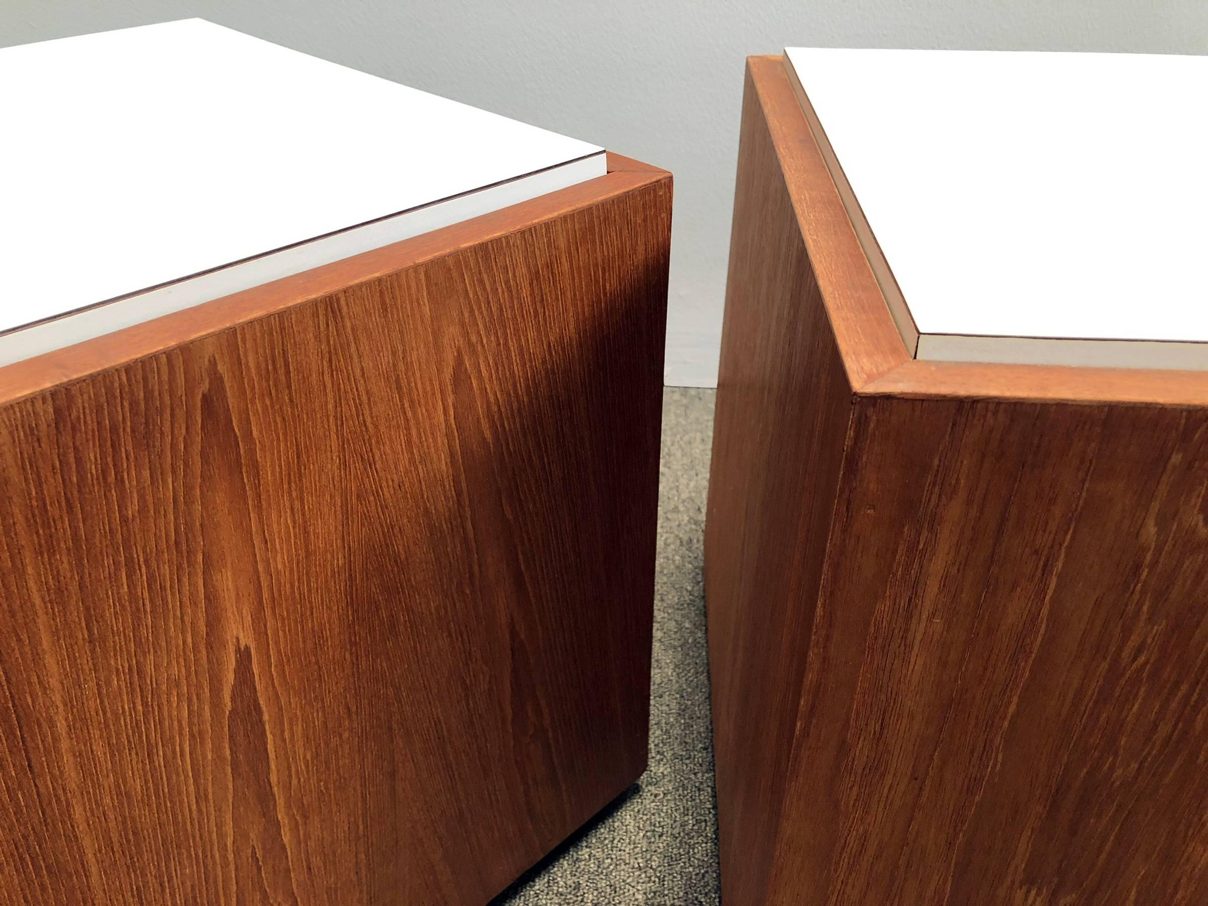 Pair of teak and Formica cube tables. Features removable tops for storage. Price is for the pair.