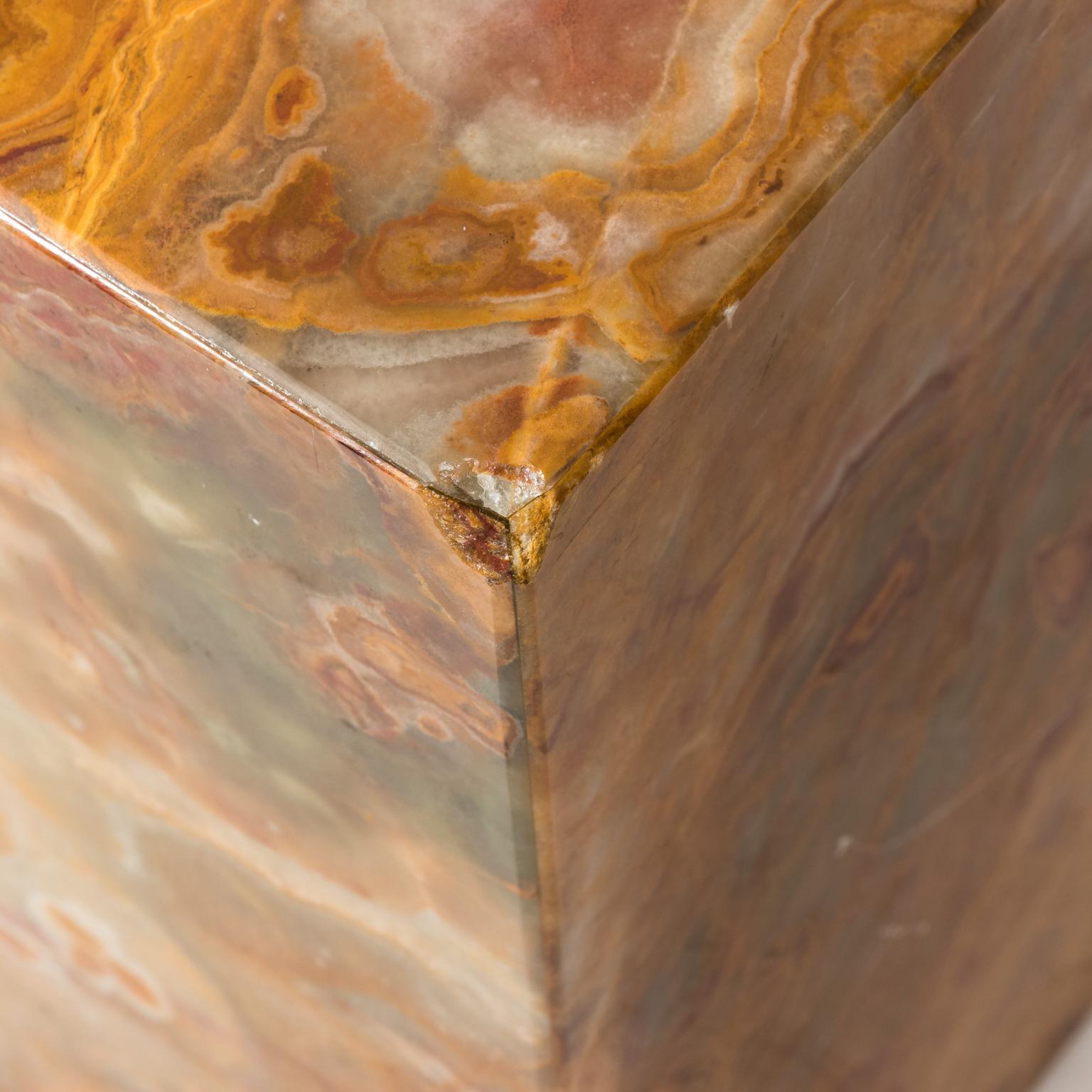 Pair of cubed marble veneer side tables, circa 20th century. Please note of wear consistent with age including chips of various sizes throughout. There is also a large chip on the corner.
 
