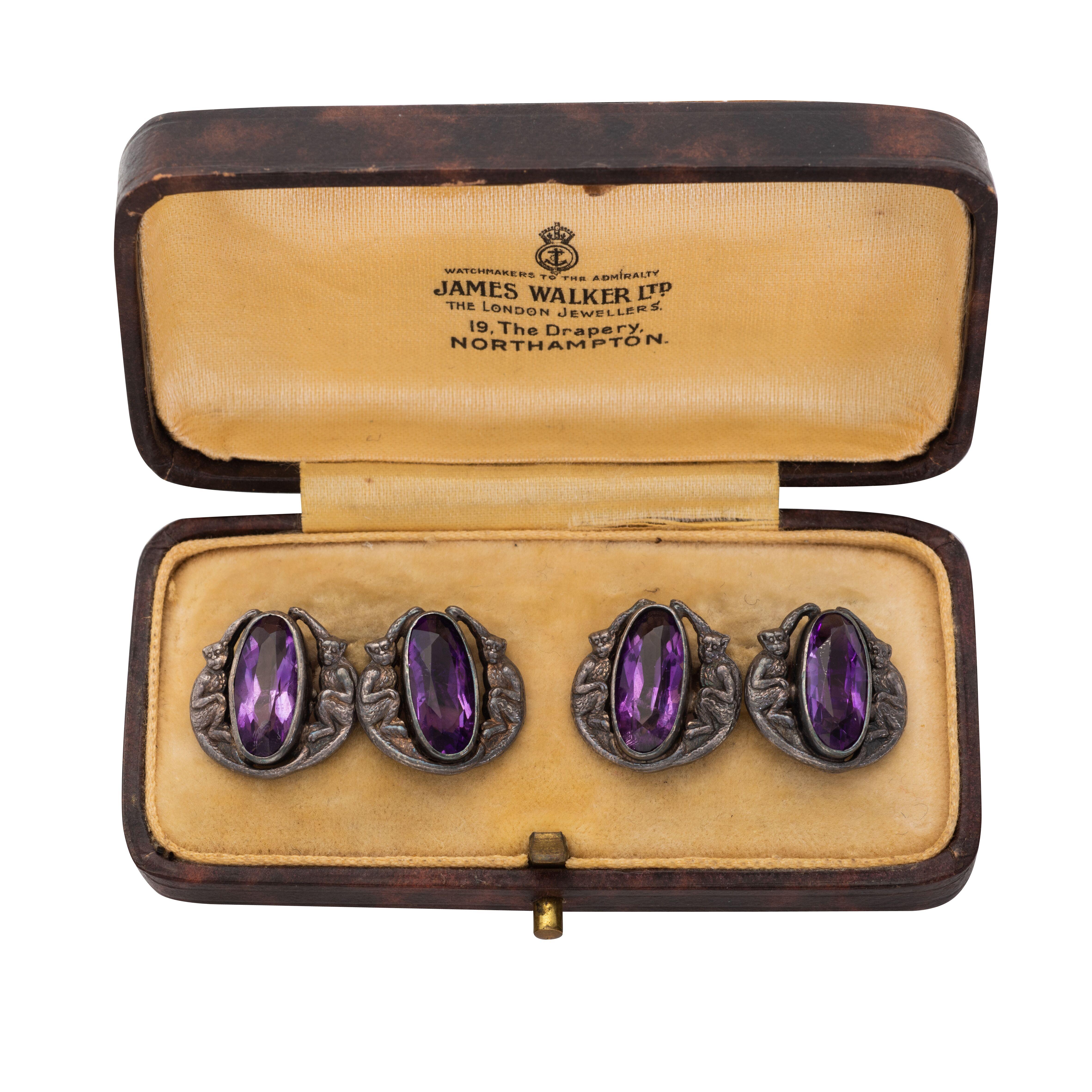 
Pair of cufflinks, retailed by James Walker, London 
Set with carved amethyst, set in sterling silver
total gross weight 9.3 grams, fitted case signed James Walker Ltd