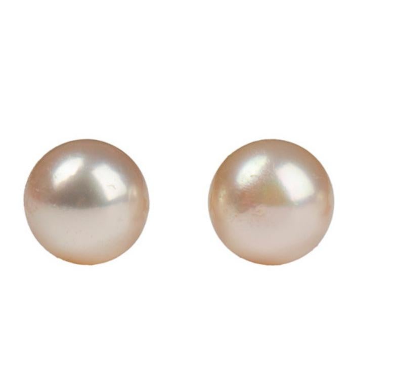Beautiful pair of classic cultured pearl earrings, each pearl of high luster and even white color with pink overtones. The round pearls measure 7.7 mm, attached to 14 karat yellow gold posts for stud earrings.

21st century, new

Excellent condition