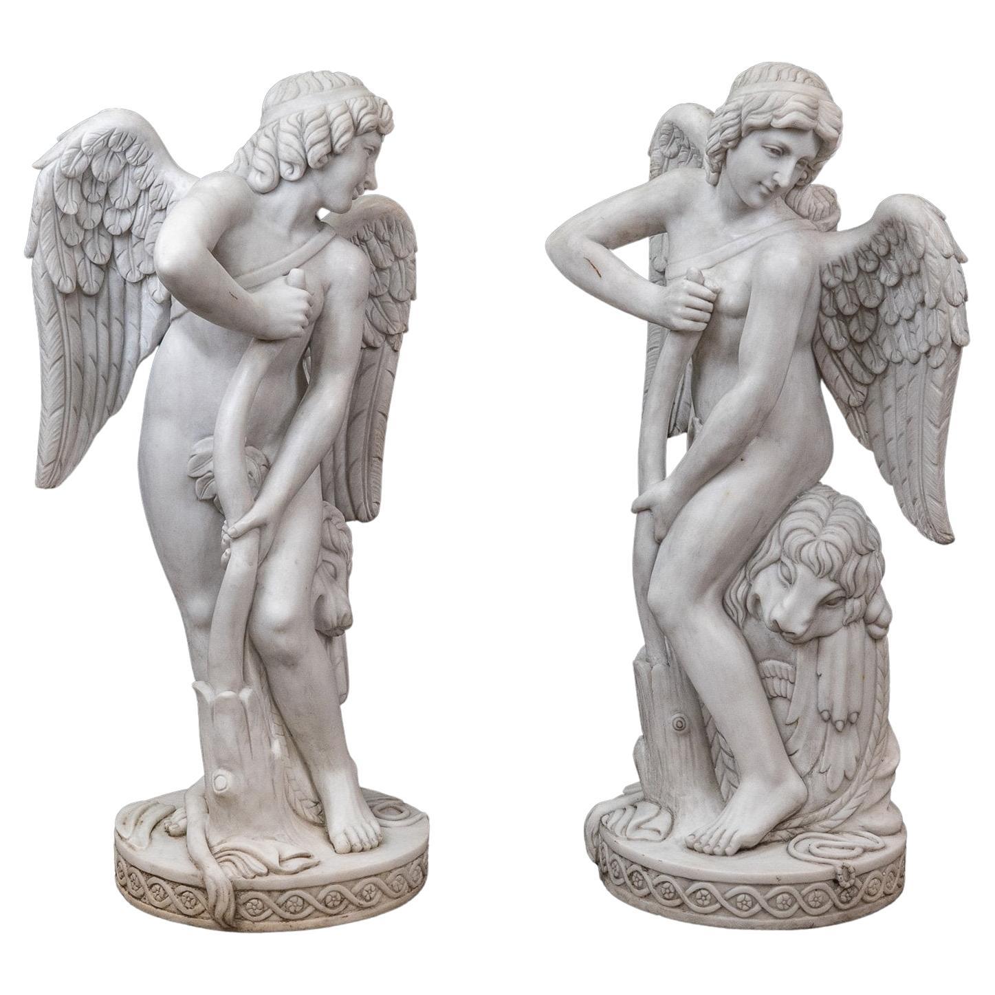 Pareja de esculturas de Cupido en mármol H 106 cm en venta