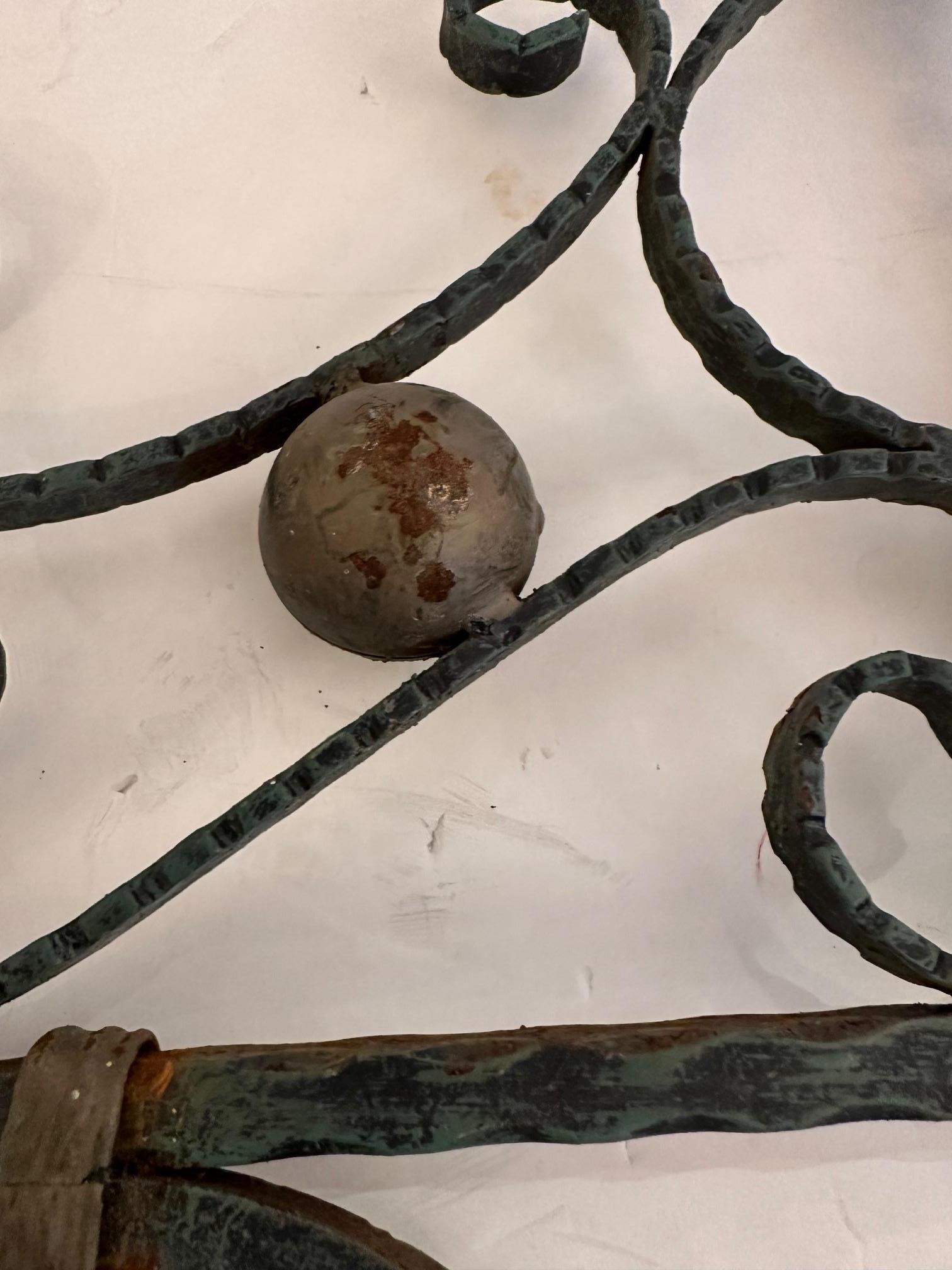 Pair of large ornate eye catching cast iron decorative brackets that make wonderful found object wall art.  Can be hung as protruding brackets or flat on a wall.
