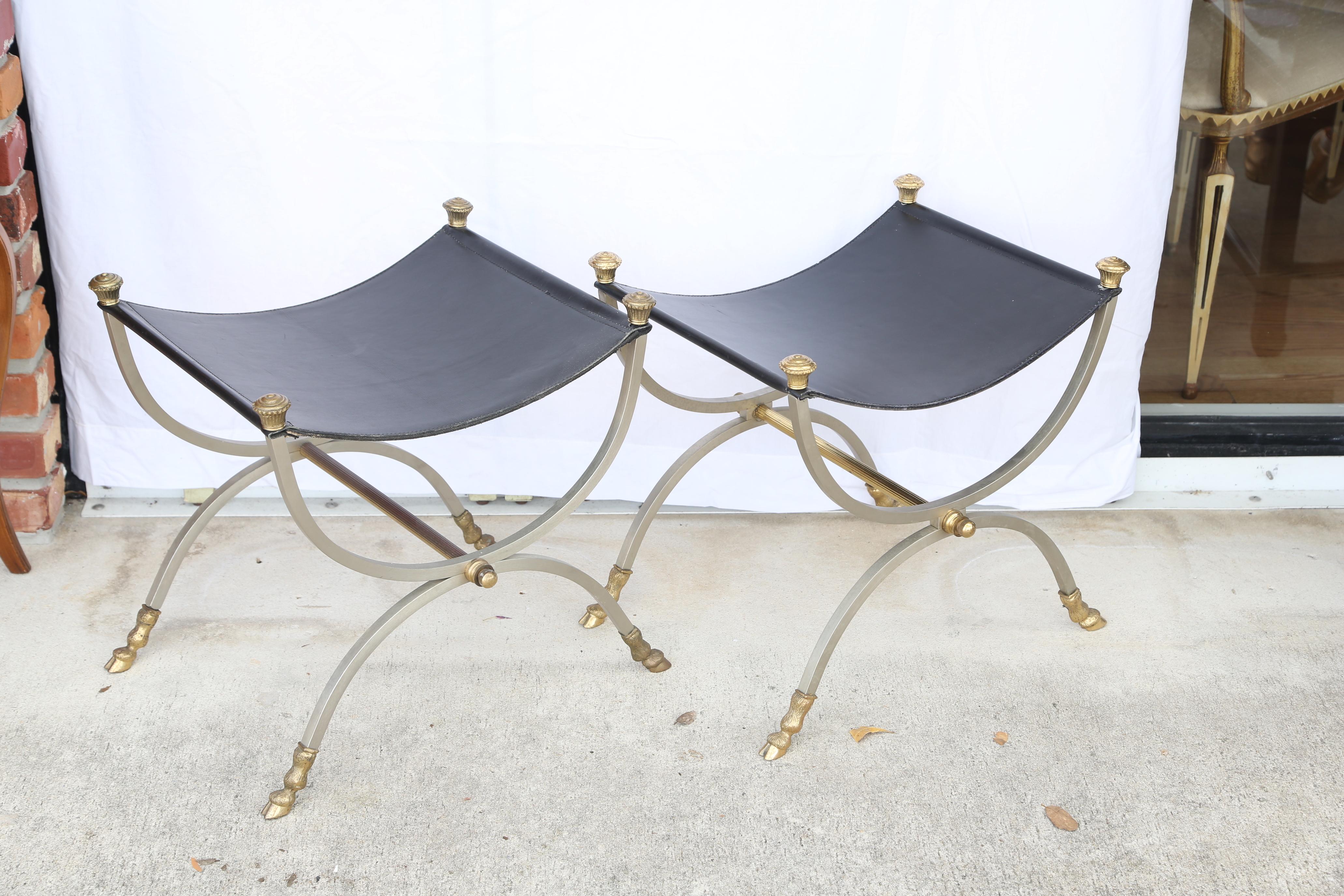 Pair of brushed steel and brass Campaign benches with black leather seats by Jansen.