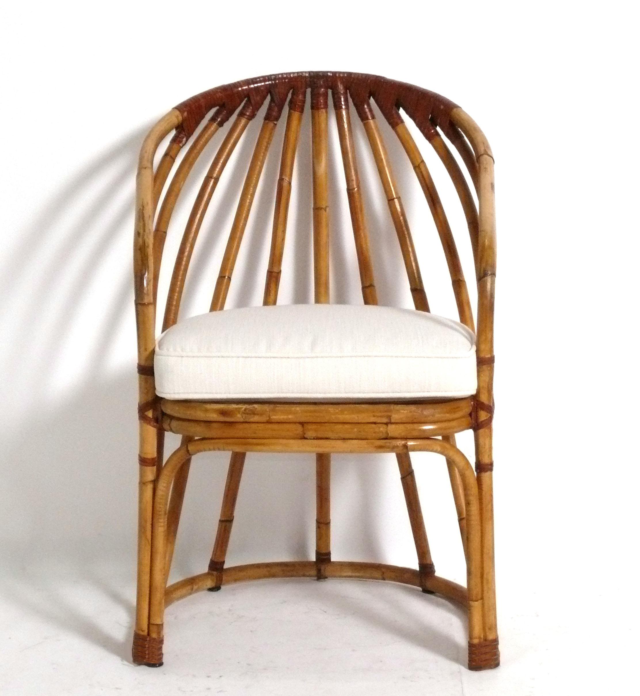 Pair of Curvaceous Rattan Chairs, attributed to The McGuire Company, Asian, circa 1960s. Please see our Gabriella Crespi end table on 1stdibs that would work well with these chairs. 