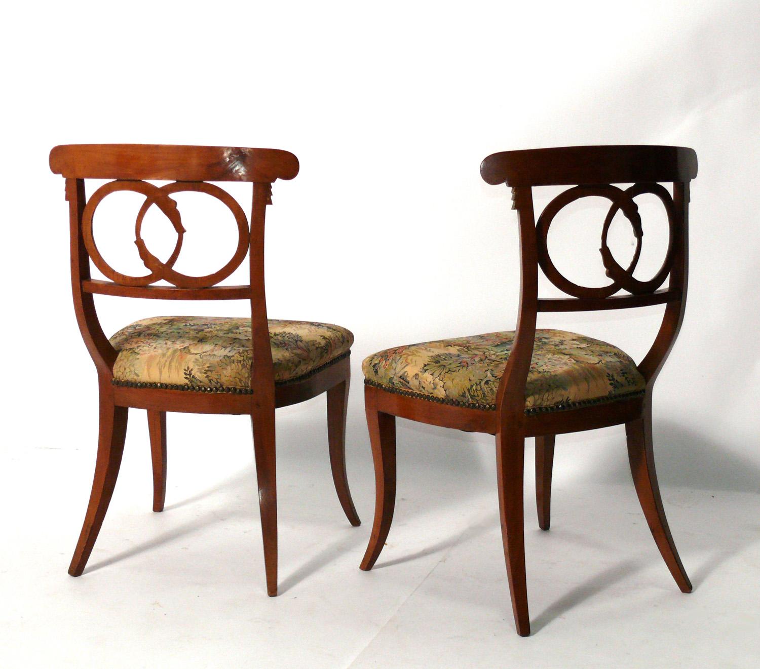 Regency Pair of Curvaceous Italian Chairs with Gilt Ouroboros Decoration For Sale