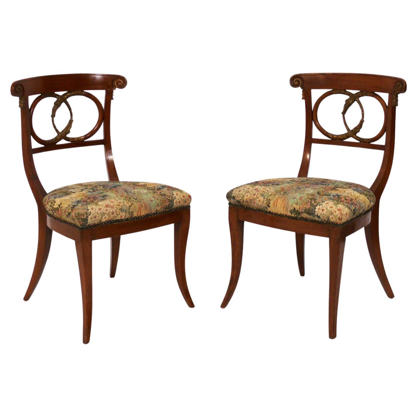 Pair of Curvaceous Italian Chairs with Gilt Ouroboros Decoration For Sale