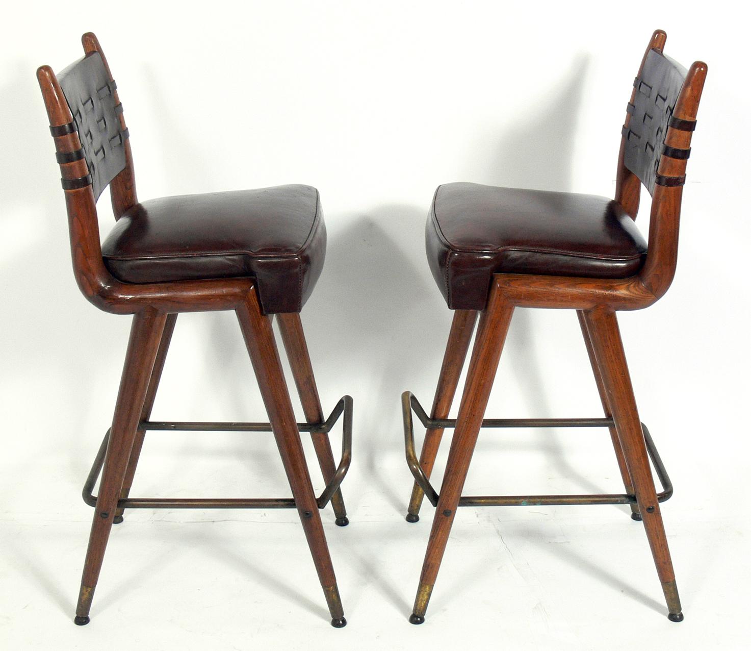 Mid-Century Modern Pair of Curvaceous Oak Leather and Brass Bar Stools