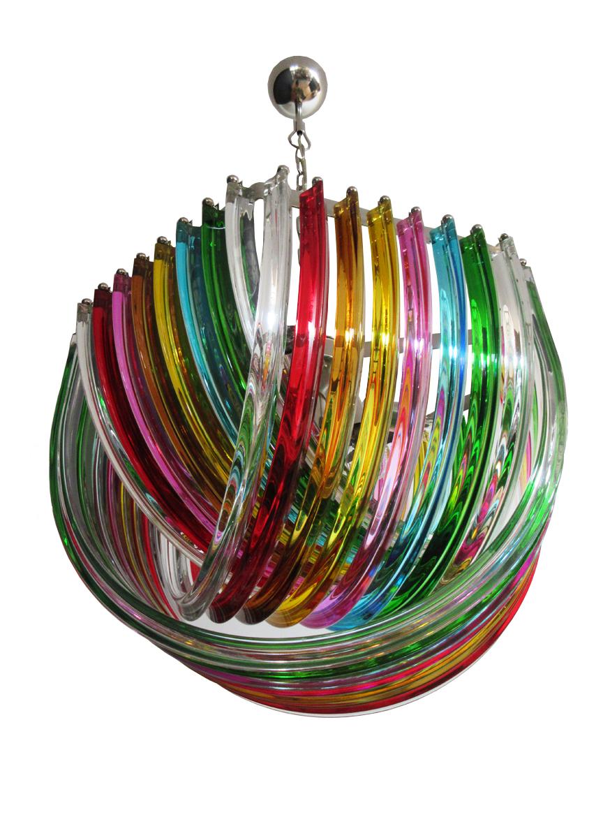 Large Curvati rainbow ceiling light, multicolored Triedri, 24 Murano glasses
Murano ceiling light multicolored glass with three layers of curving “triedri” glass prisms on an hexagonal chrome structure. A dynamic form, changing as you move around
