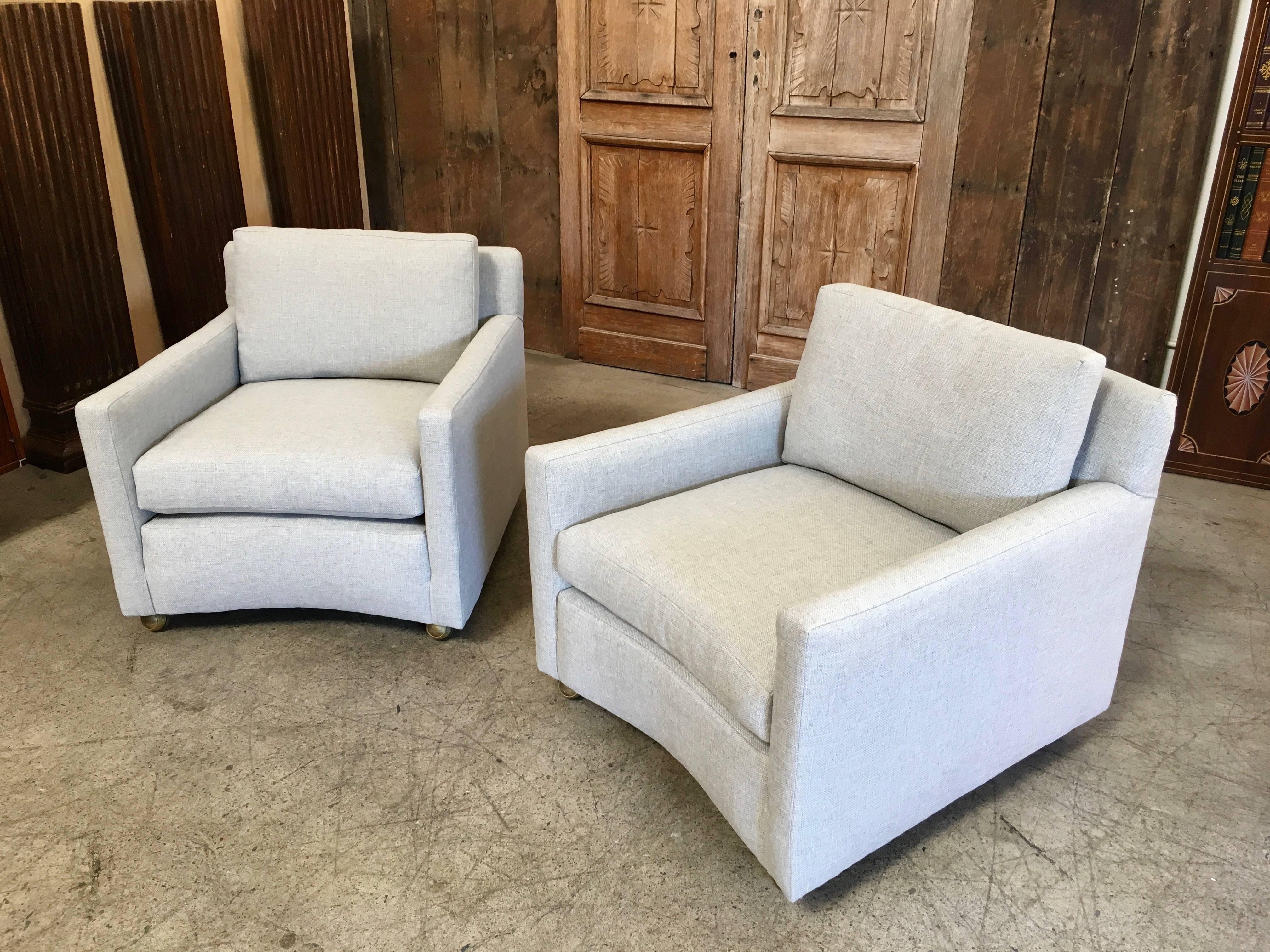 Very angular with curved front and back club chairs. Down filled cushions for the best comfort and the practicality of casters to keep these mobile with that floating look.