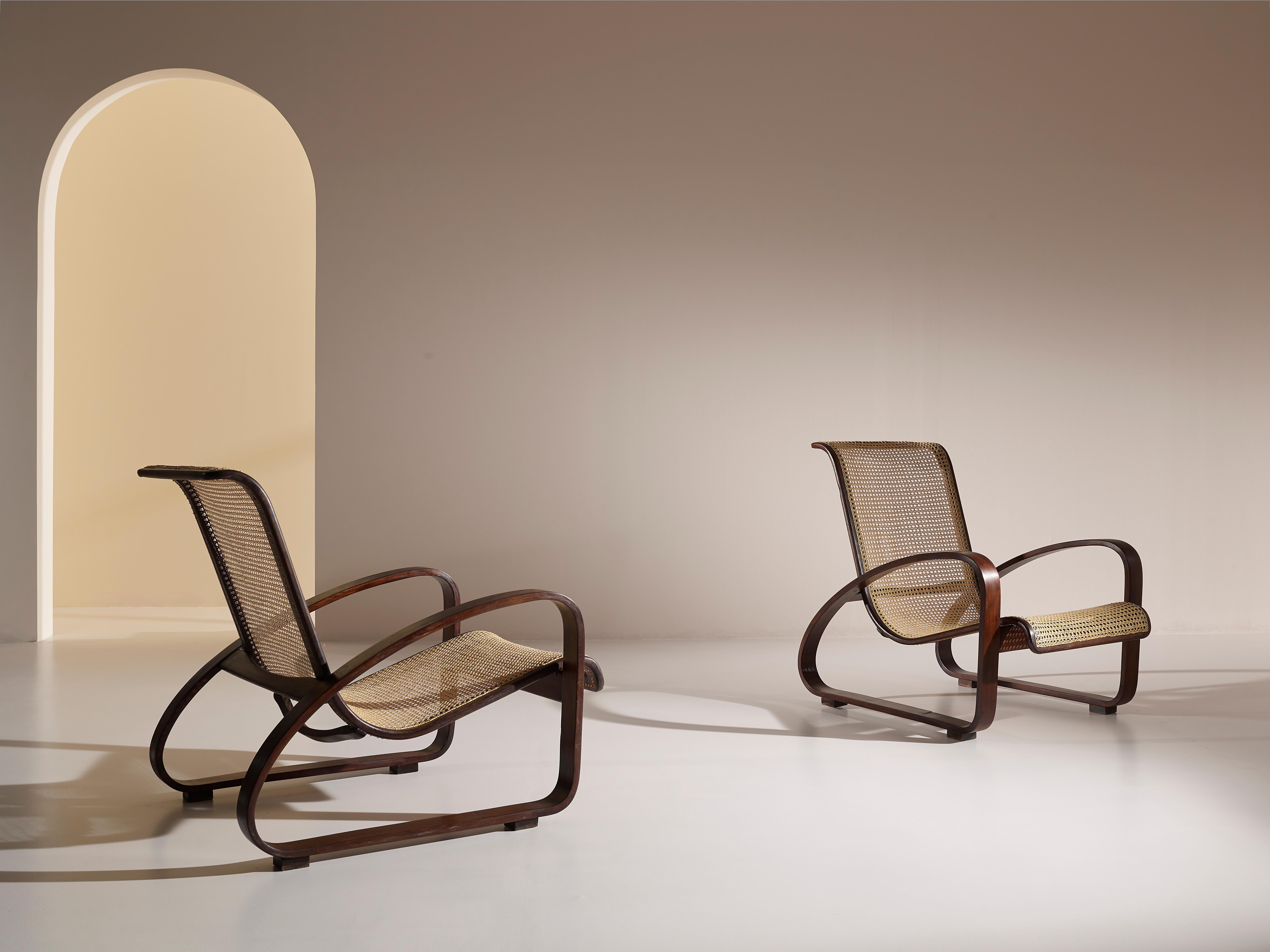 One of a kind pair of lounge chairs produced by Ditta Porino (Torino - Italy) in the 1930s.

Designed between the two world wars, this armchairs have an astonishing clean and simple lines emphasised by the use of curved beechwood for the frame and