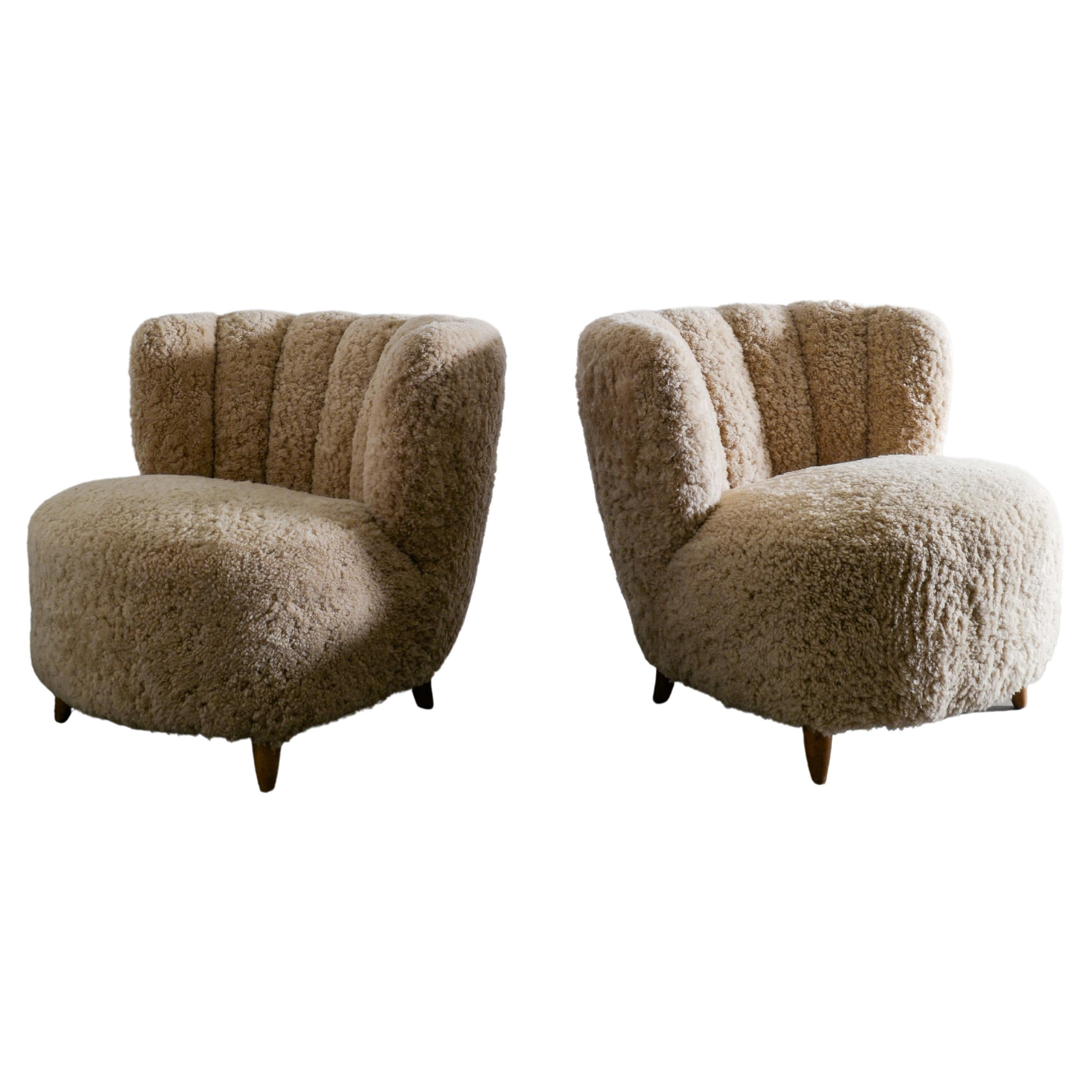 Pair of Curved Danish Easy Lounge Chairs in Sheepskin Produced in Denmark 1940s