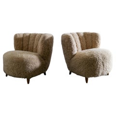 Pair of Curved Danish Easy Lounge Chairs in Sheepskin Produced in Denmark 1940s