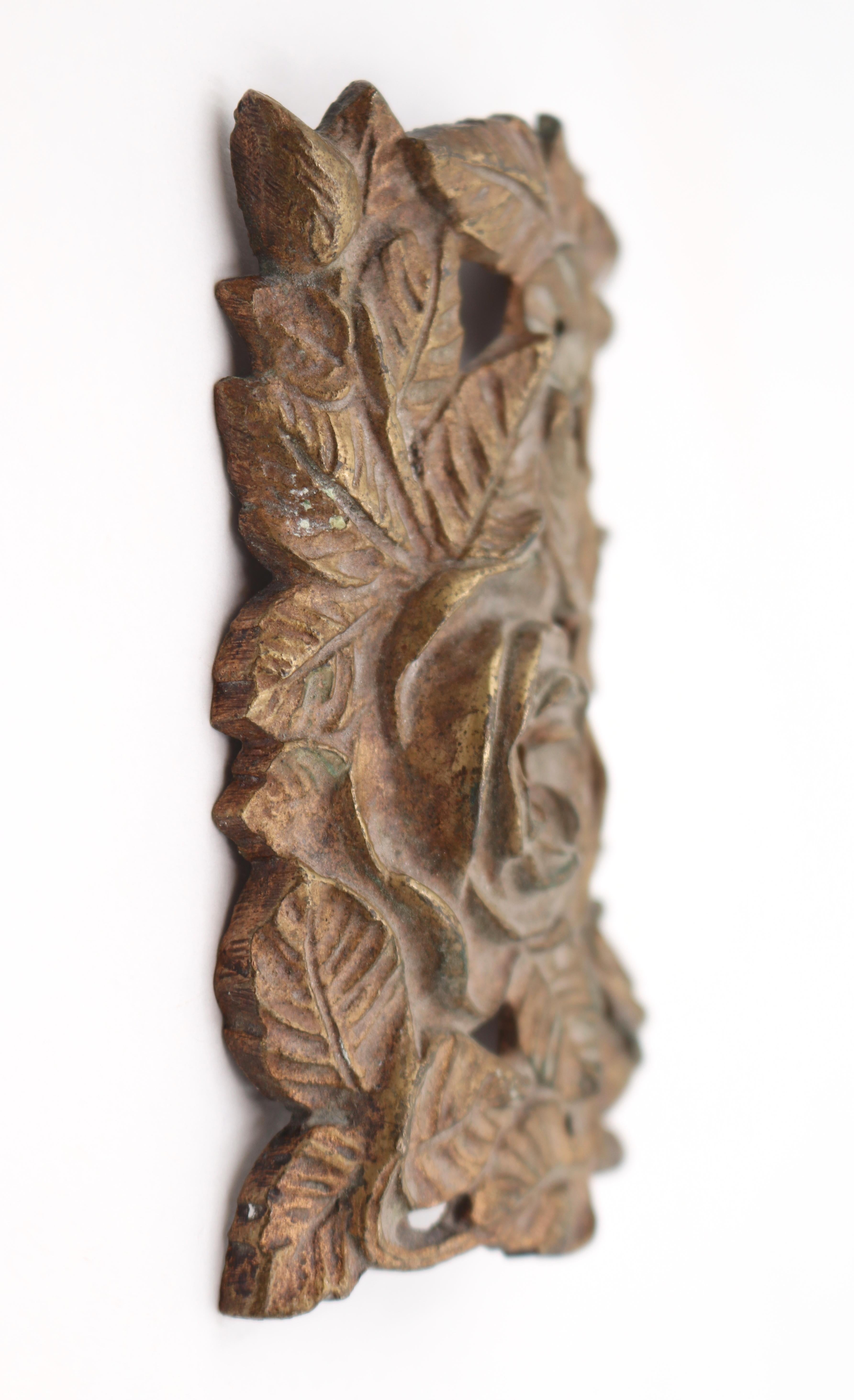 Rectangular shaped bronze appliques, curved vertically, with raised floral details. The original mounting screws are not available. Good condition with surface wear from prior use. Priced as a pair. Please note, this item is located in our Scranton,