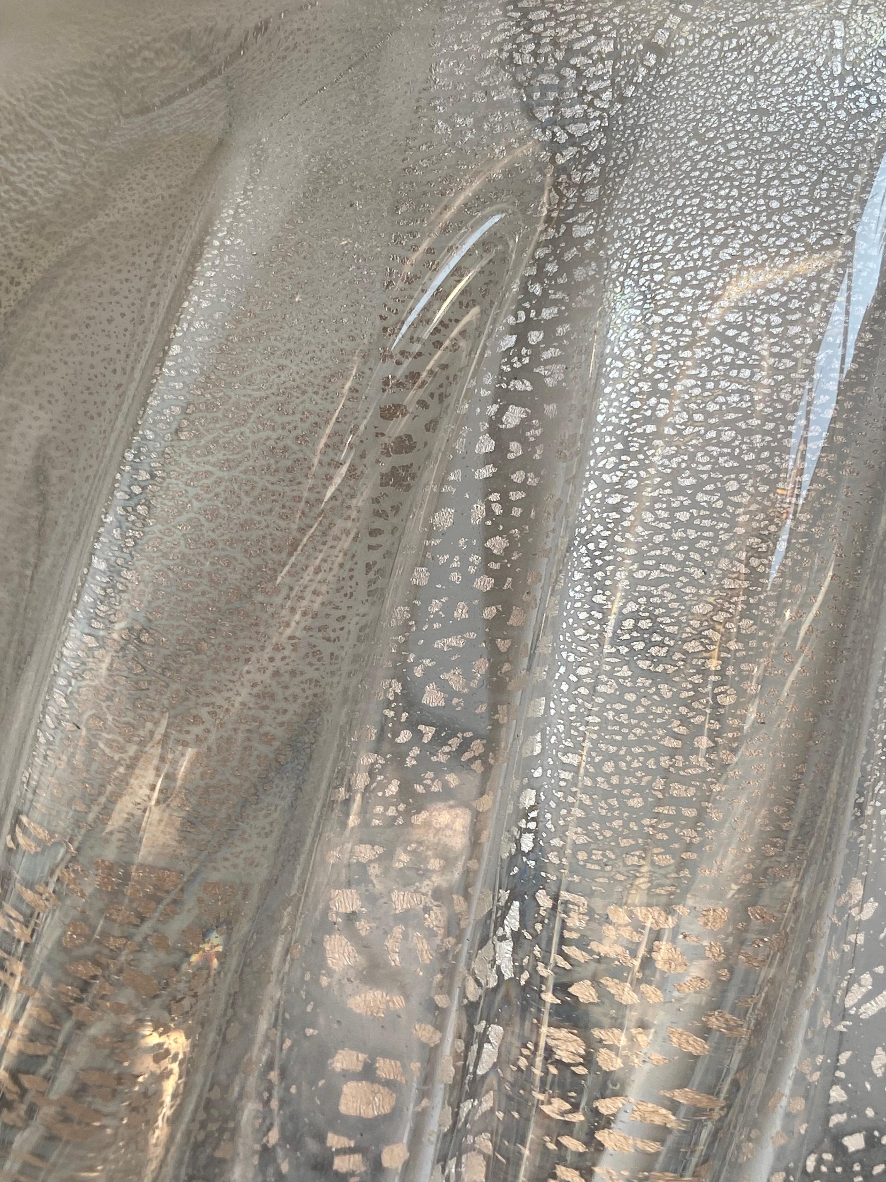 Elegant pair of vintage Murano glass table lamps featuring textured curved forms with a frosted finish. Mounted on matching powder-coated grey bases with original metal fittings, these lamps blend Italian craftsmanship with timeless design. Shades