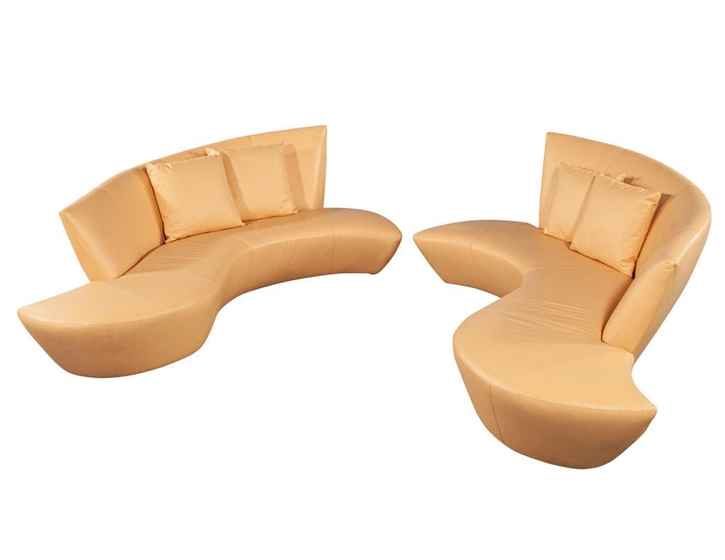Pair of curved leather Mid-Century Modern sofas by Weiman. Made by Weiman, Iconic mid-century modern design, all original, circa 1970’s USA. Sofas include 2 matching pillows. All original with manufacturers tag. Price includes complimentary curb