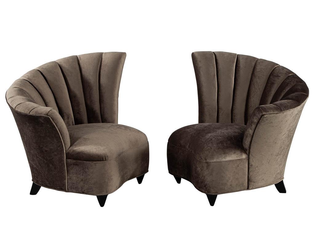 Pair of curved shell channel back lounge chairs. Beautiful channel shell back design upholstered in a luxurious and rich velvet material. A truly dimensional piece to add flair to any room.

Price includes complimentary curb side delivery to the