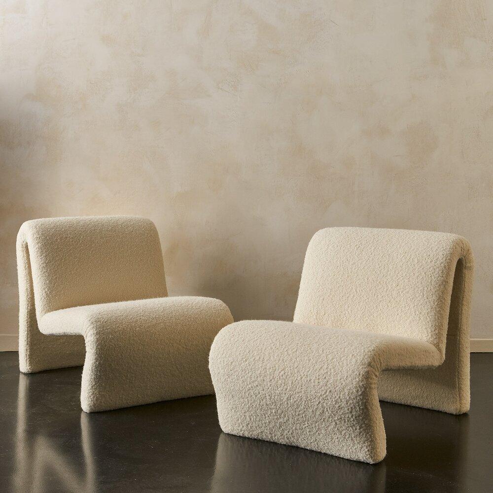 A beautiful and sculptural pair of vintage chairs, sourced in France and carefully restored and upholstered in a luxurious ivory alpaca wool boucle. In the mood of Etienne Fermigier’s design, the Ondo chair.

France, 1970s.

Dimensions: 23