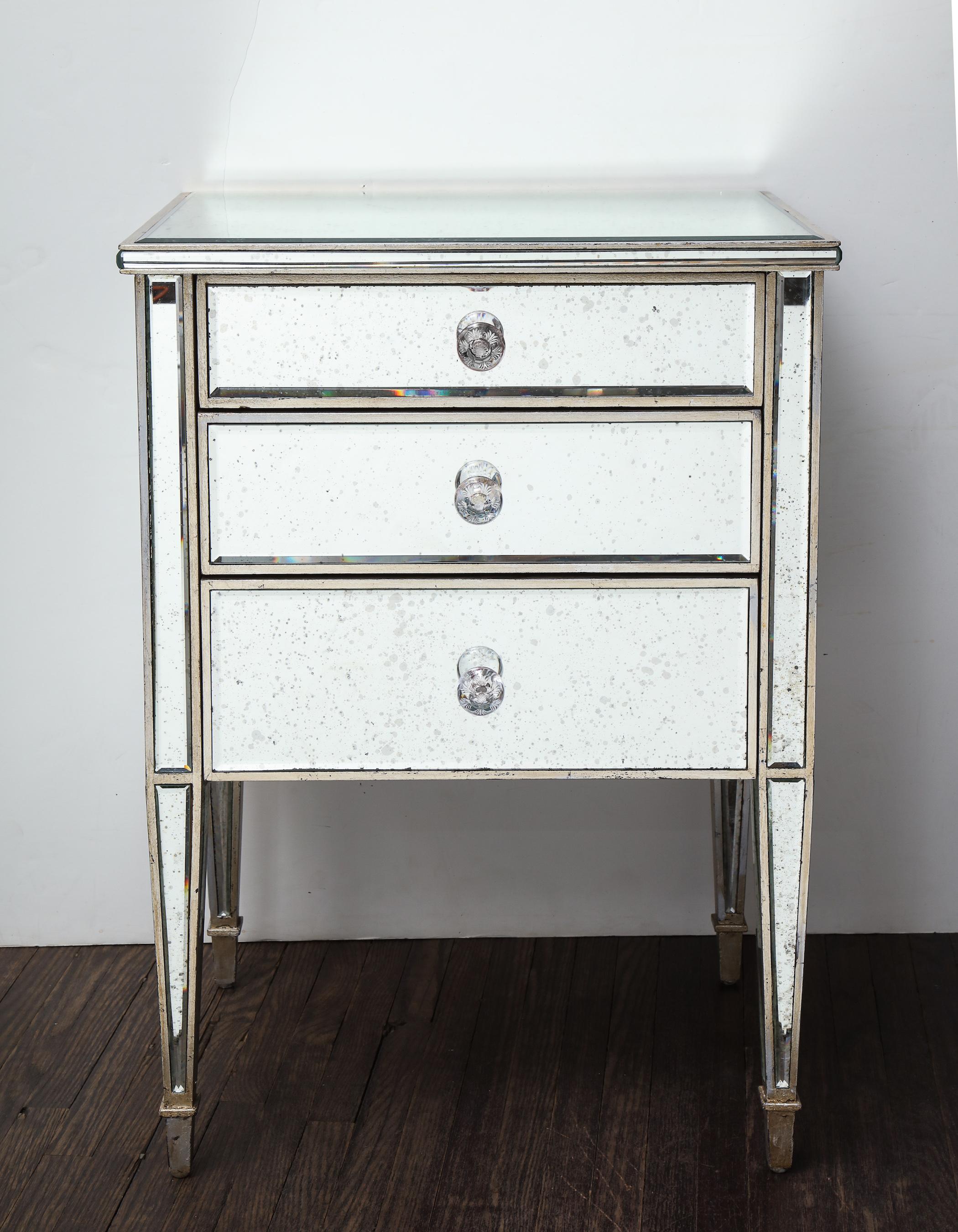 Pair of antique mirrored nightstands with silver gilt trim. Customization available in different sizes, finishes and hardware.